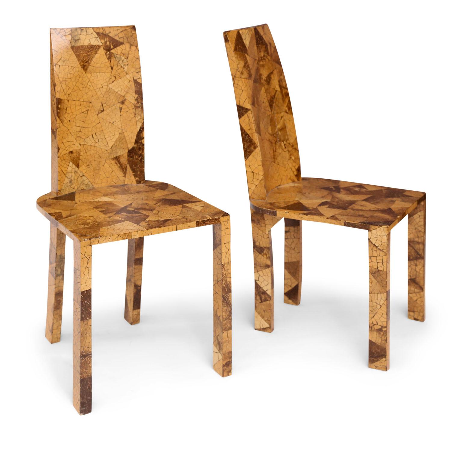 Pair of midcentury veneered side chairs in a clear lacquer finish. Veneer applied in a mosaic of light and dark wood triangular patterns. Purchased in Paris and constructed circa 1970-1989 in the style of Karl Springer.