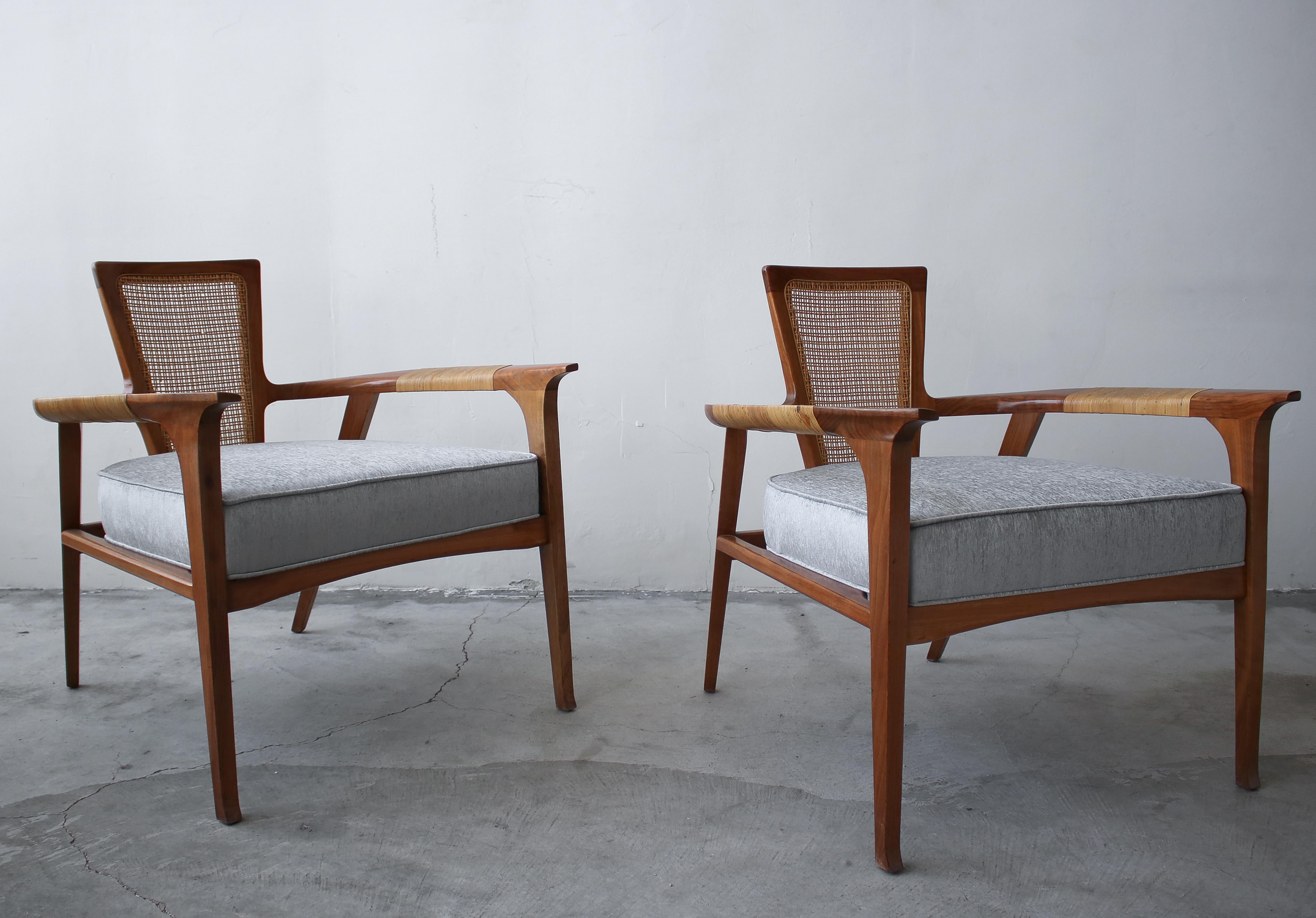This extremely rare and sculptural pair of midcentury lounge chairs was designed by William Hinn for The Urban Furniture Company, Swedish Guild Collection. If you've been looking for a gorgeous pair of statement chairs with the most amazing details