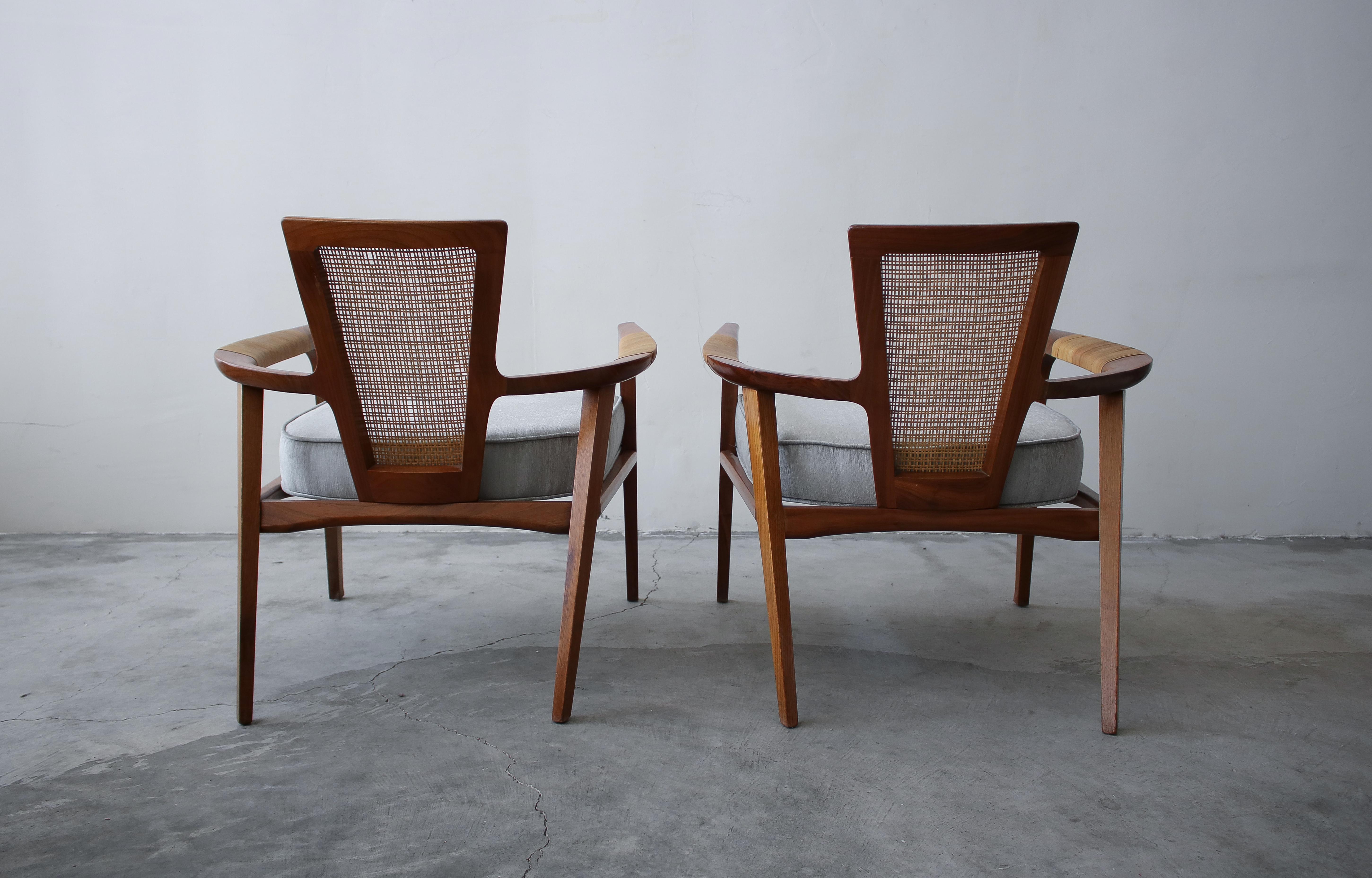 Pair of Midcentury Walnut and Cane Lounge Chairs by William Hinn 1