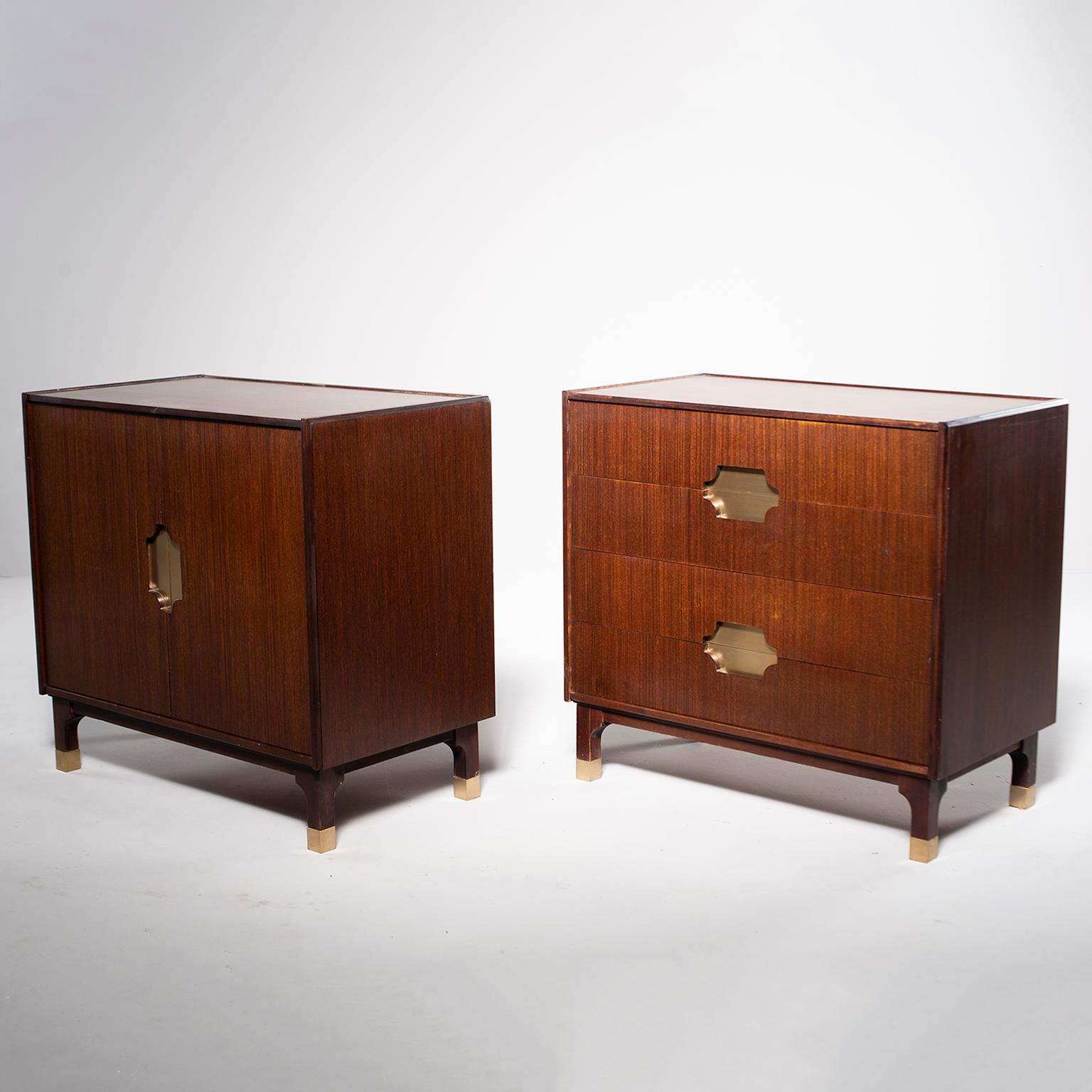 Pair of circa 1970s mixed style side cabinets by Grazia. Both are made of walnut with brass accented inset handles. One cabinet is chest of two drawers and the other has two hinged doors that open to a storage compartment with single internal shelf.