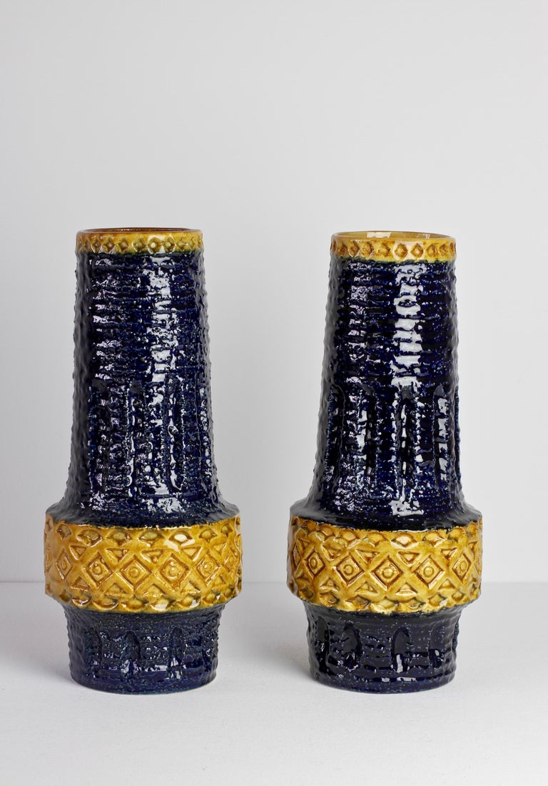 Pair of vintage midcentury handmade vases by West German Pottery manufacturer 'Spara', Germany, circa 1970s. The embosse/impressed relief pattern on these vases is not dissimilar to the style of Italian pottery designer Aldo Londi for Bitossi while