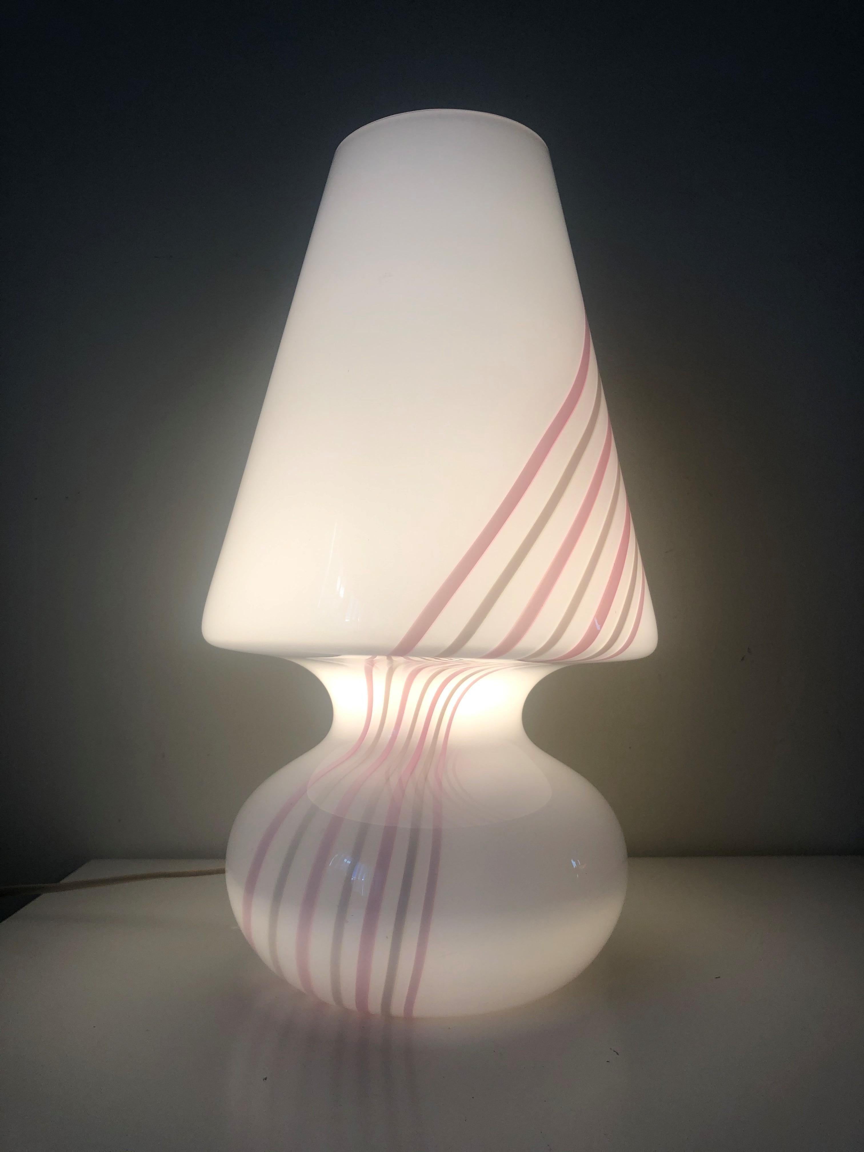 Lovely, huge and beautiful pair of white Murano table lamps with pink stripes. These pieces were made during the 1980s, Italy.
Each table lamp is equipped with one light sockets (E27). A professional electrician has checked and prepared the piece