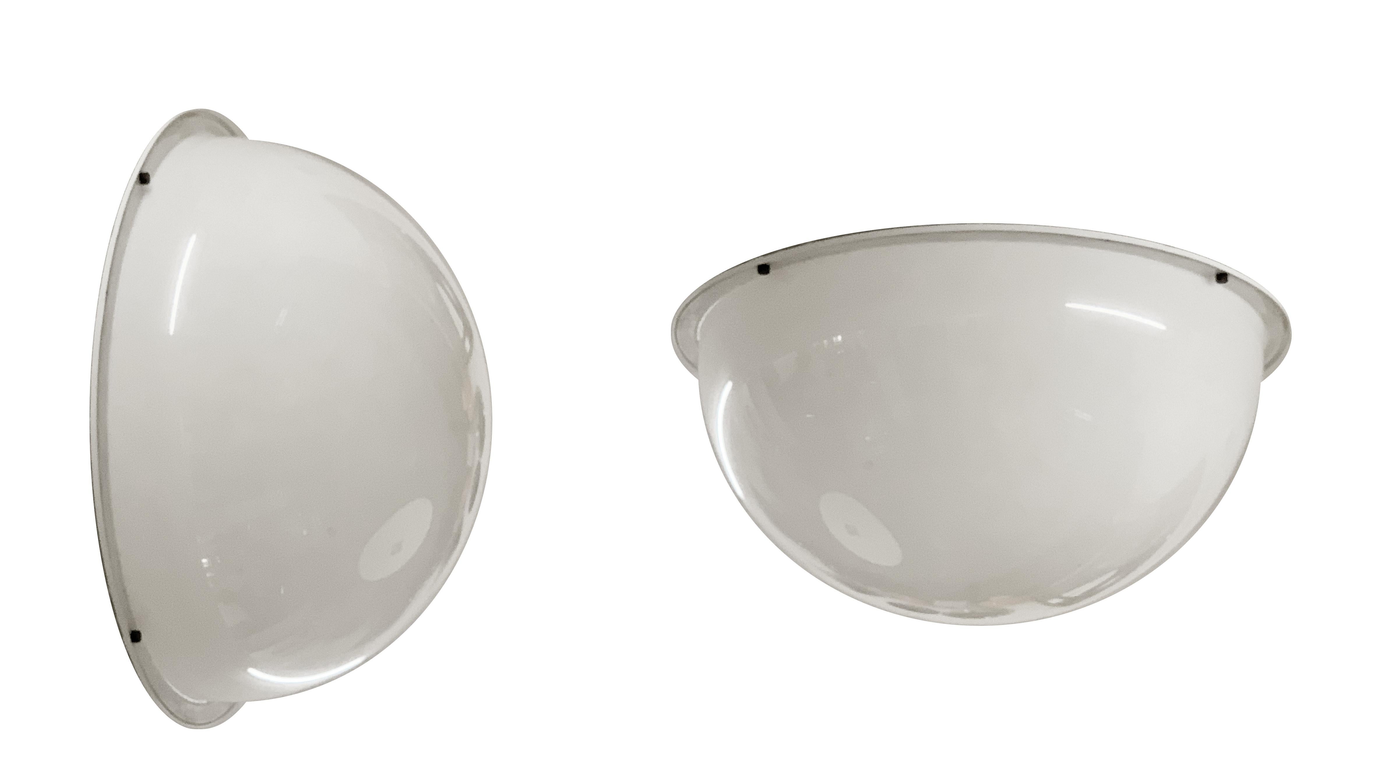 Large (95cm) ceiling lights in white plexiglass. They were produced in Italy during 1970s.

The base is an enameled metal plate, the half-white plexiglass sphere is hooked with 4 solid brass bolts. Beautiful and rare of great effect. They can be