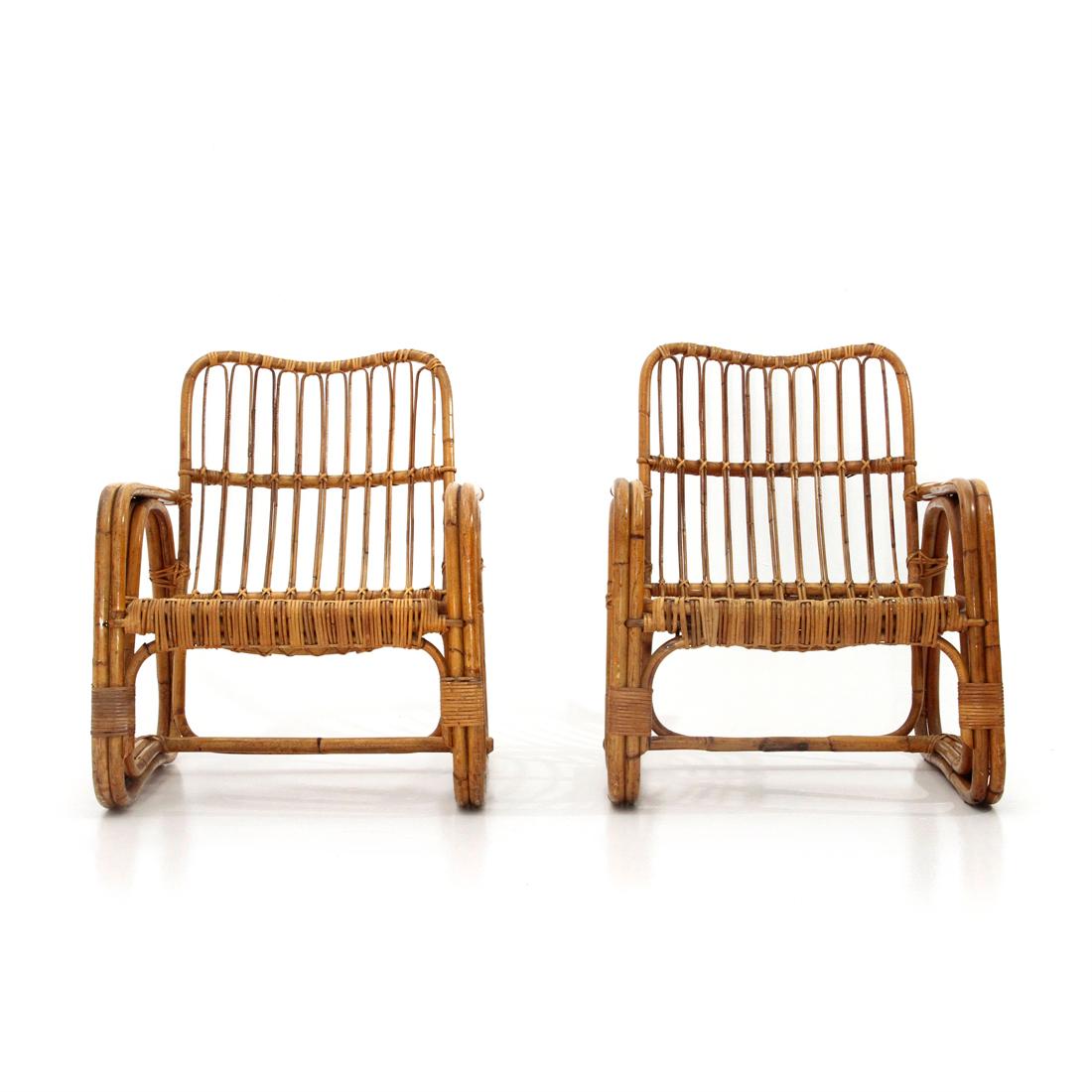 Pair of Italian-made rattan armchairs produced in the 1950s.
Curved bamboo structure.
Seat and knots in rattan.
Good general conditions, some signs due to normal use over time.

Dimensions: Length 64 cm x Depth 70 cm x Height 81 cm x Seat