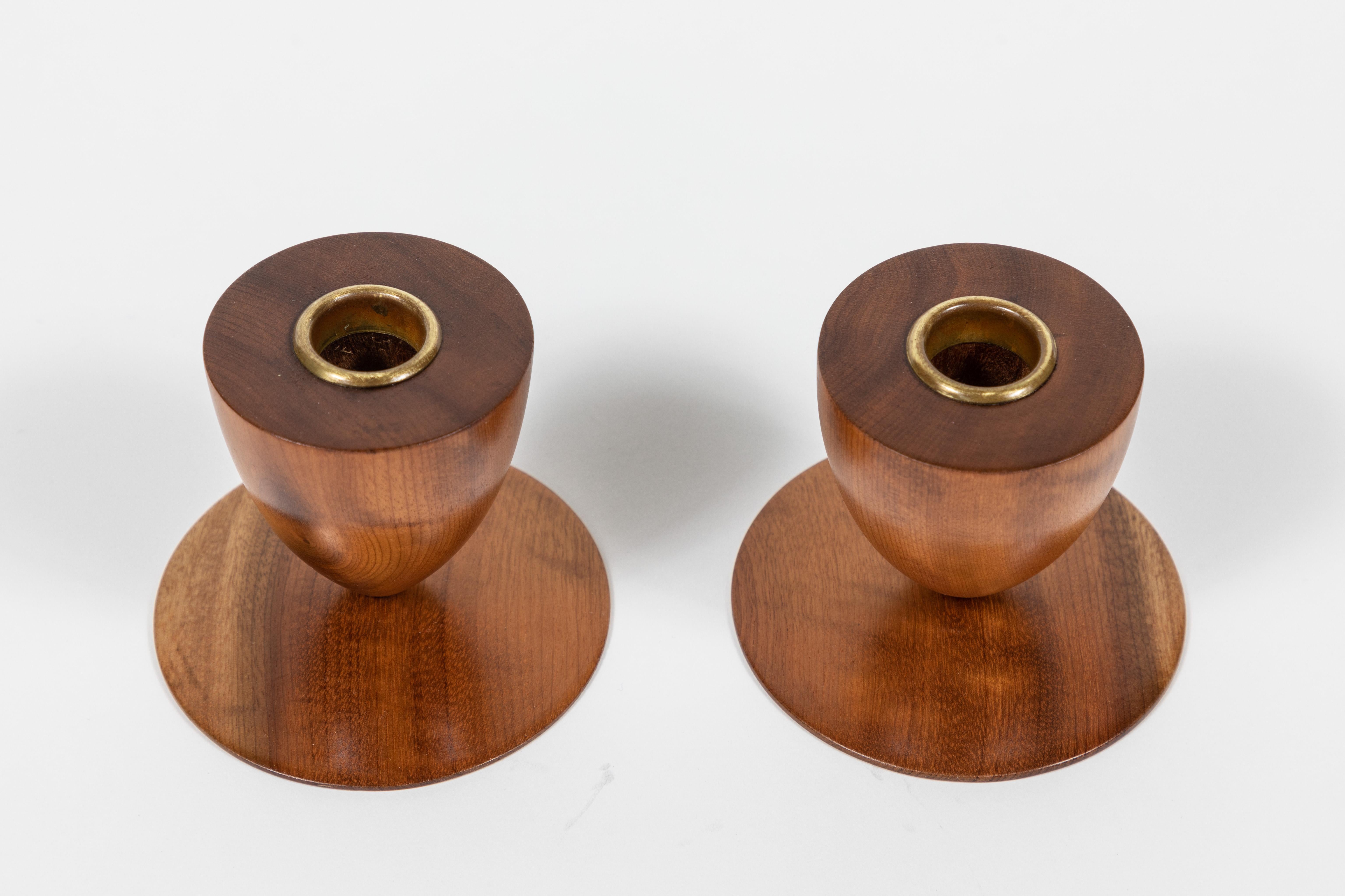 Pair of midcentury wood footed candleholders.