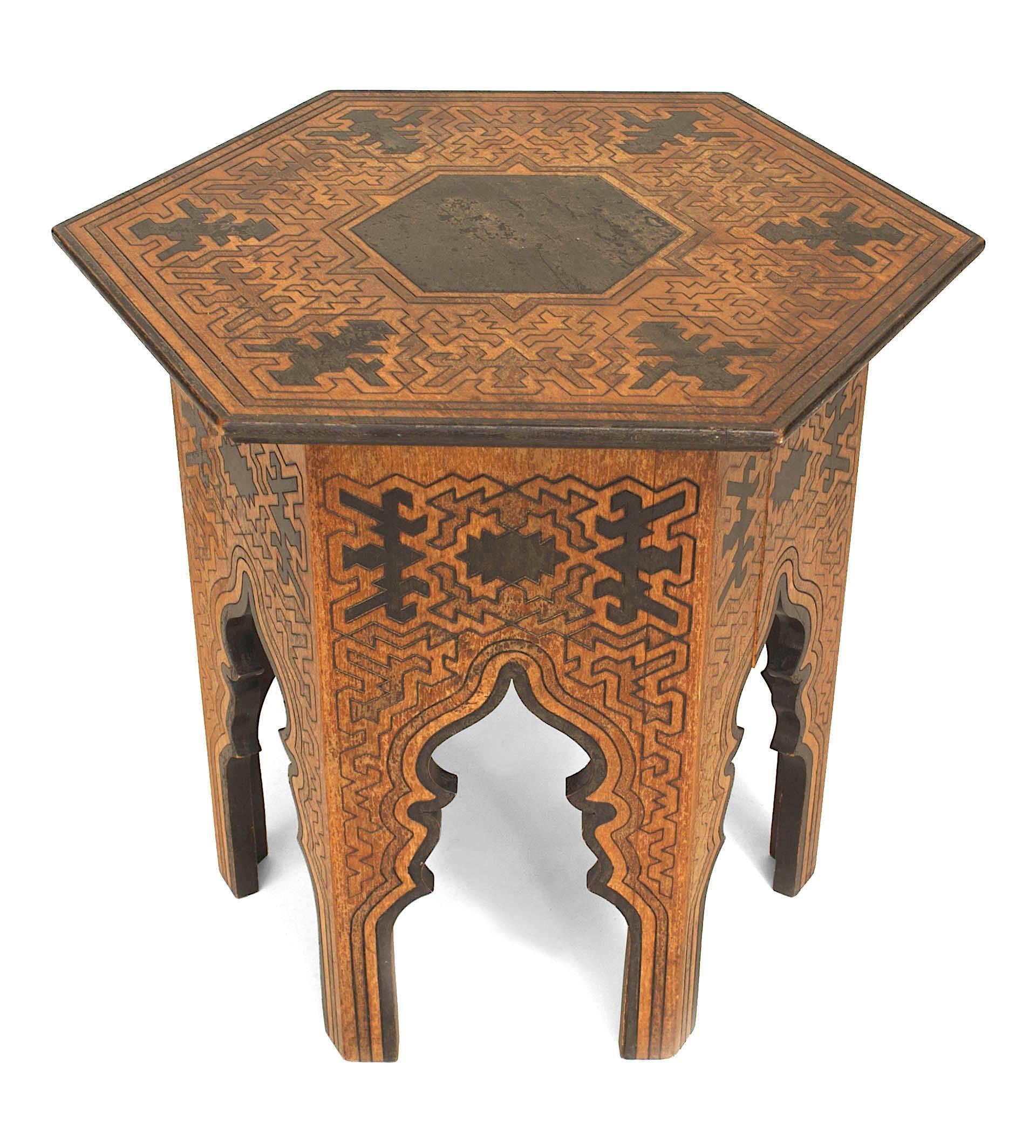 Middle Eastern Moorish-style (probably American 1890s) six-sided low table (taboret) with a geometric etched and ebonized burnt wood design with arch forms on base.
