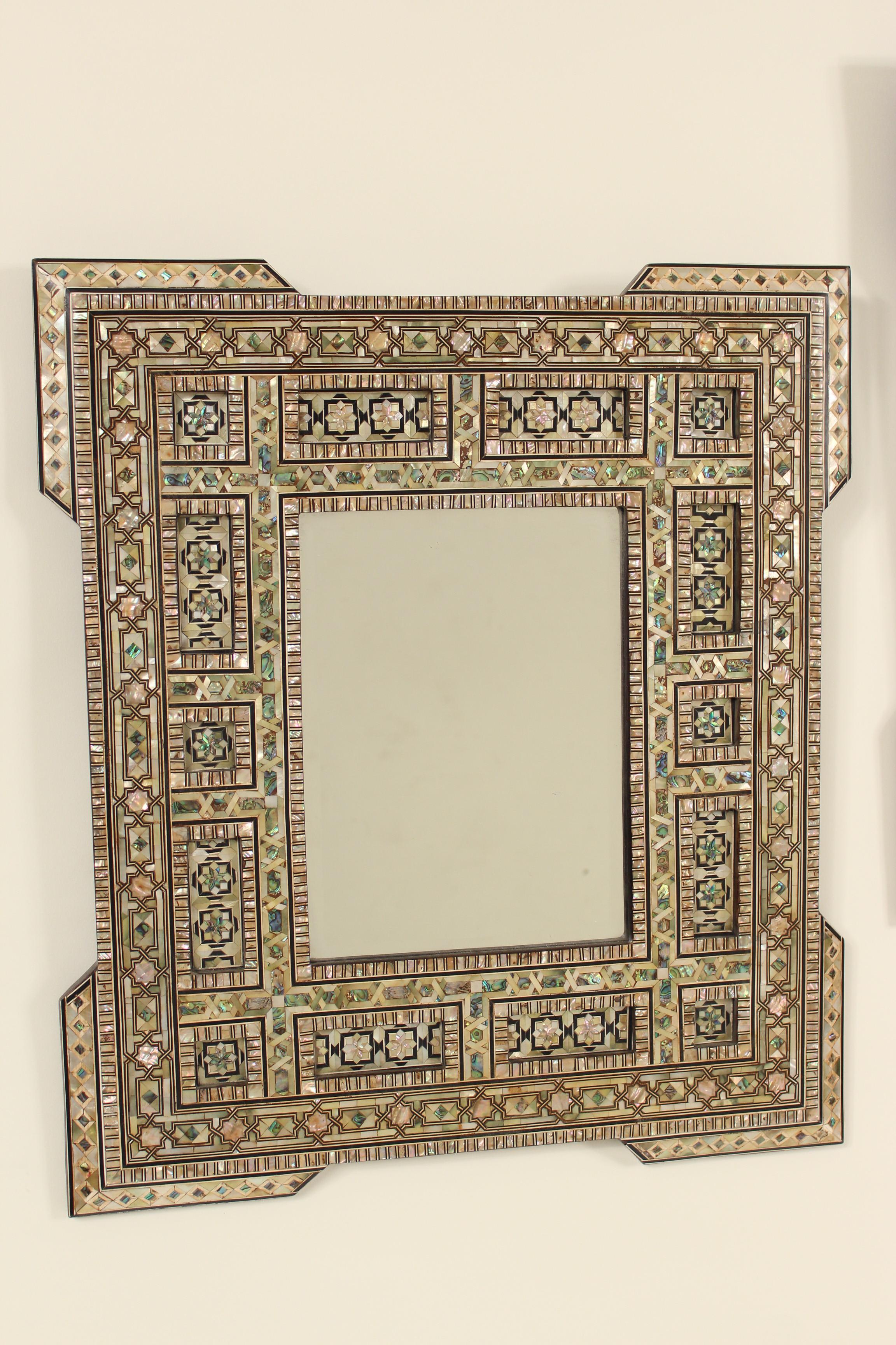 Pair of Middle Eastern mother of pearl inlaid mirrors, early 21st century.