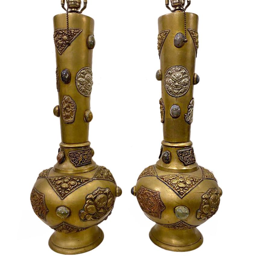 Pair of circa 1960s middle-eastern style table Indian brass table lamps with applied repousse' metal details and cabochon stones.

Measurements:
Height of body 24