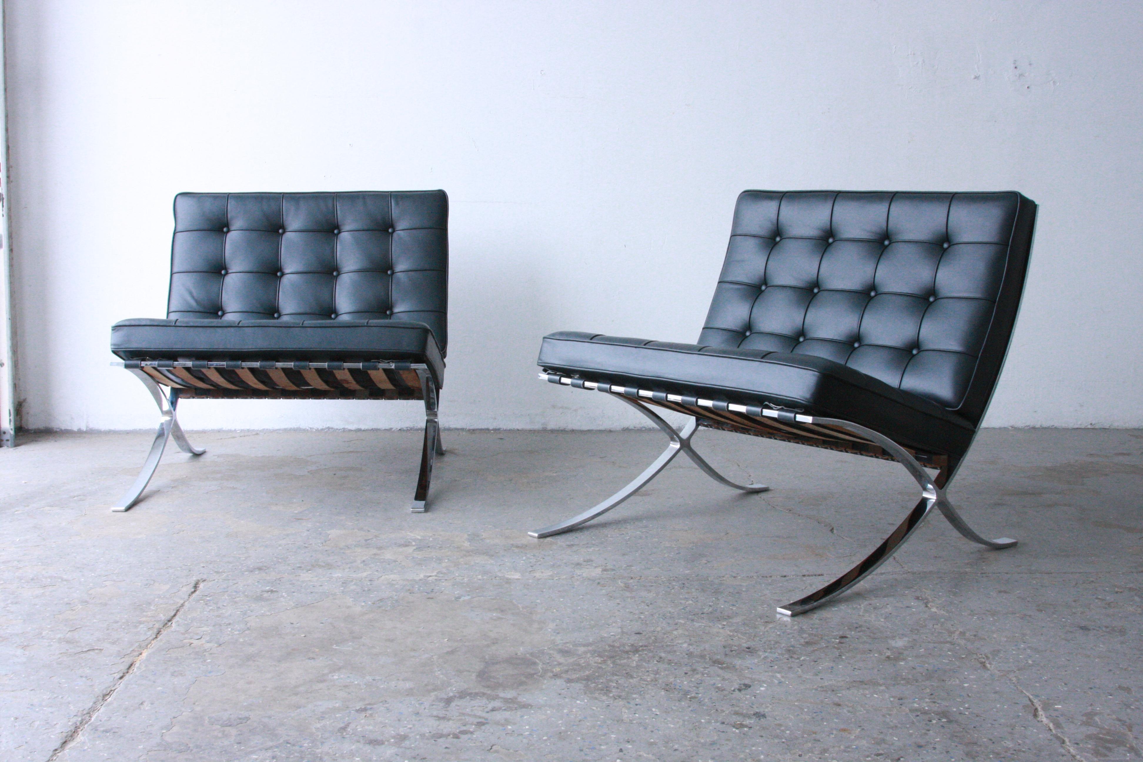 Pair of Mies van der Rohe for Knoll Barcelona Chairs  

Pair of Vintage circa 1990’s. Barcelona chairs by Mies Van der Rohe for Knoll Dark gray charcoal leather. Engraved in the frame and marked with Knoll logo at the bottom of the cushions.. Priced