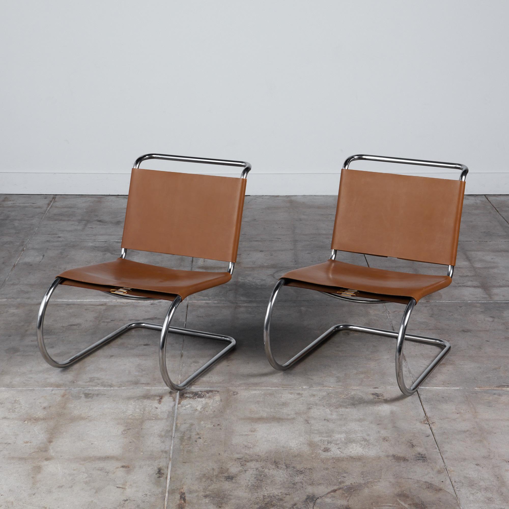 Pair of MR30 cantilevered lounge chairs by Mies van der Rohe for Knoll, c.1960s. The chairs feature a tubular chrome plated steel frame with a camel colored leather seat and backrest. The backrest and underside of the seat are finished with leather