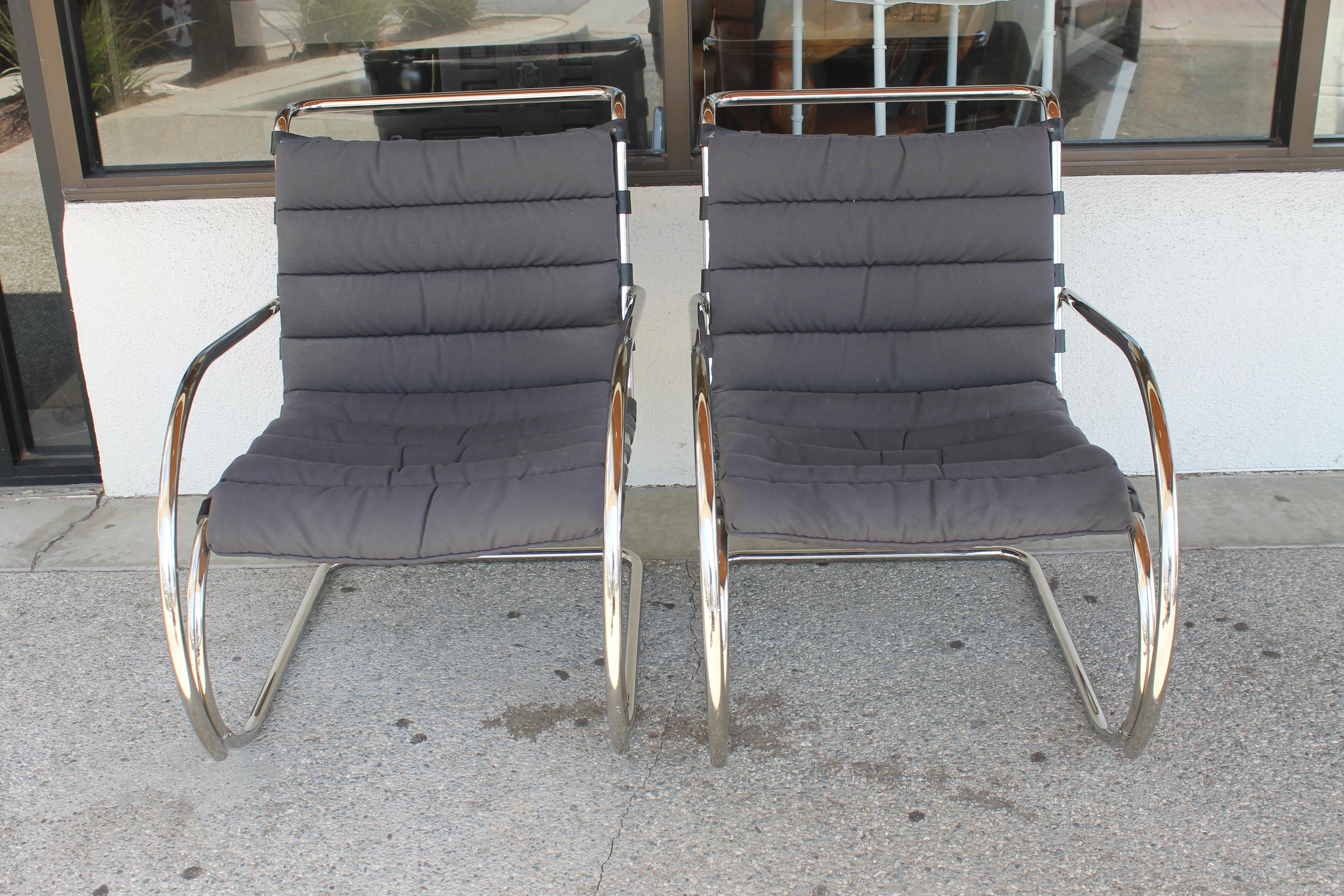 Incredible matched pair of Mies van der Rohe MR lounge chairs for Knoll International, Madison Ave, New York, NY. They both have the same date of Feb. 1986. These have a grey fabric. All original condition. Each chair measures 25.5