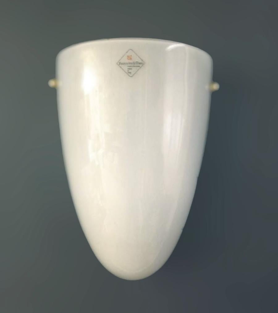 Italian wall light with creamy milky white Murano glass shield mounted on white metal frame / Made in Italy by Barovier e Toso, circa 1960s
Original sticker on the glass and frame
Measures: Height 11 inches, width 8 inches, depth 4 inches
2 lights /