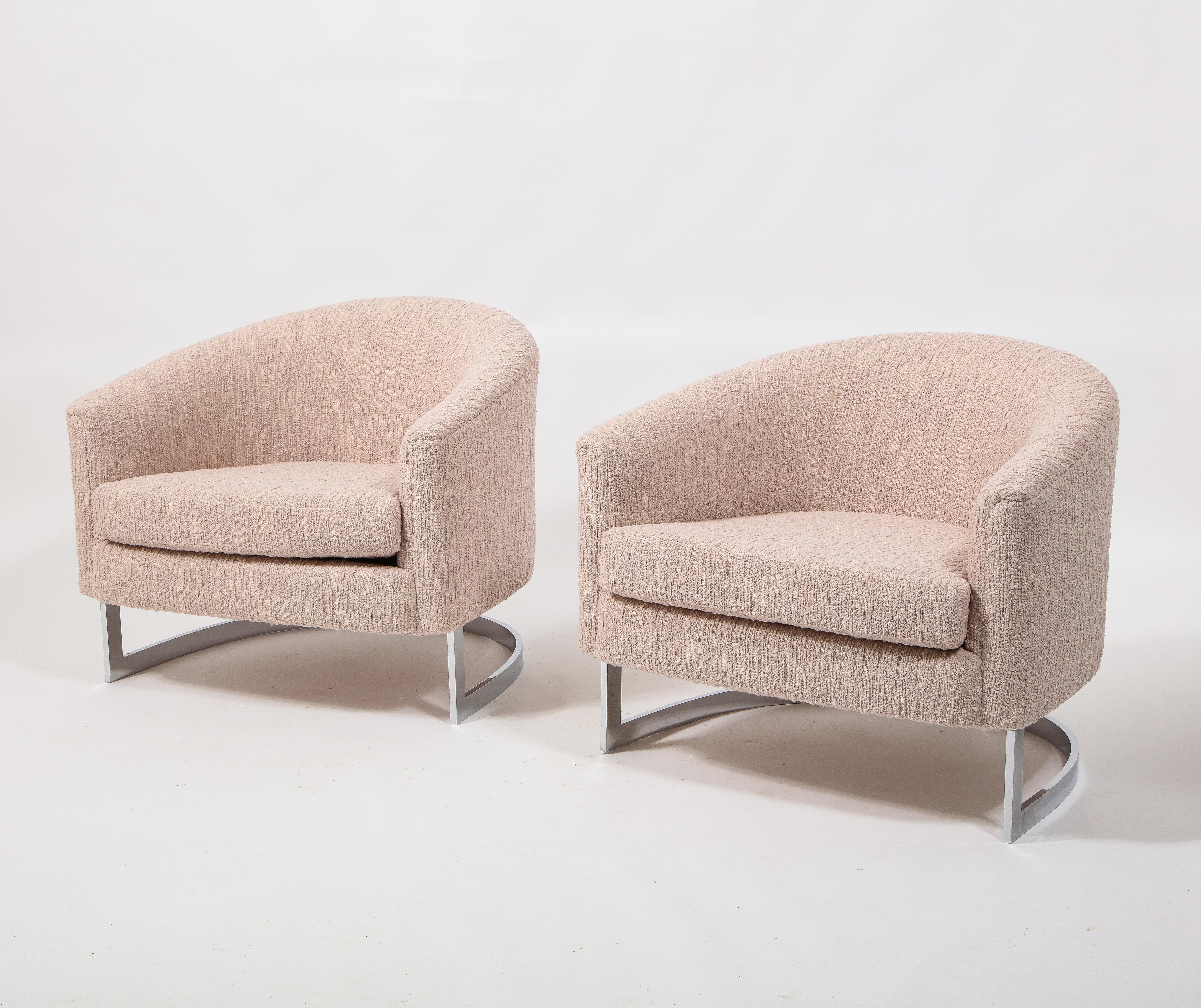 A large and comfortable pair of tub chairs by Finn Andersen for Selig, on a heavy chrome-plated steel base and upholstered in bouclé.