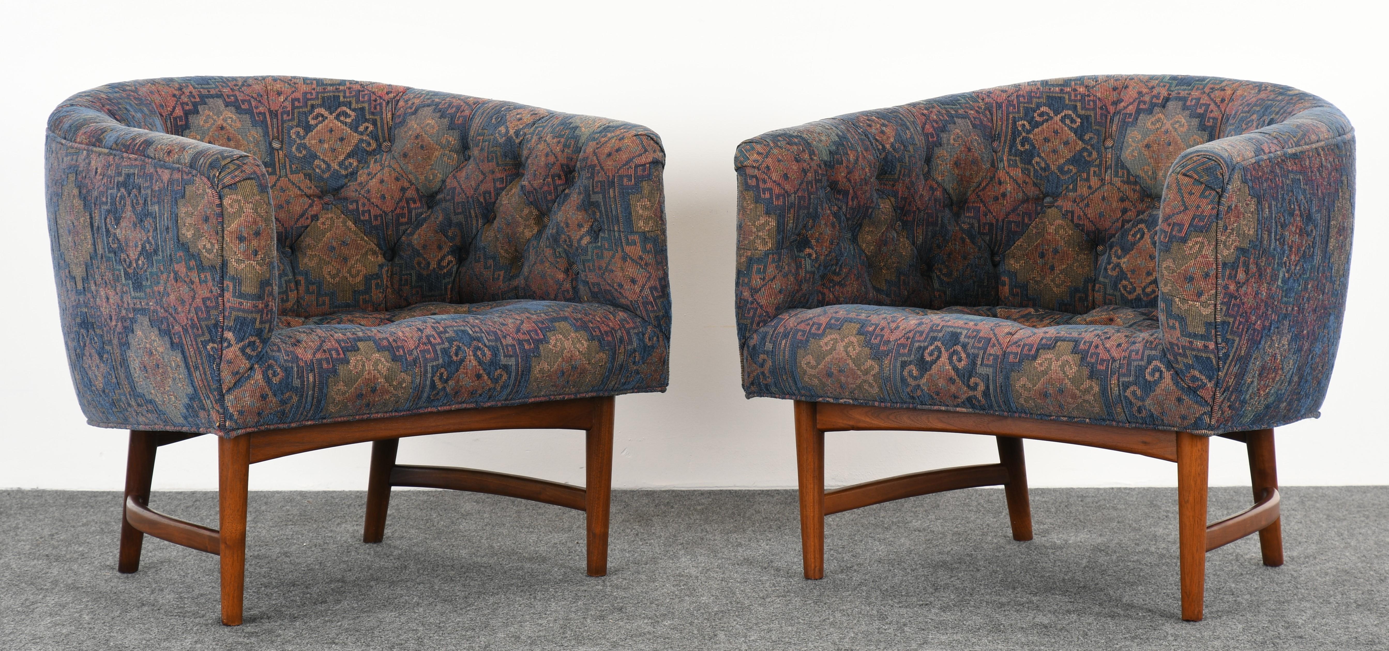 Pair of Milo Baughman barrel back lounge chairs, 1960s. Chairs sit on a sculptural walnut stretcher base. Very comfortable chairs in vintage fabric that is in good condition. New fabric suggested. There is a single chair available that matches this