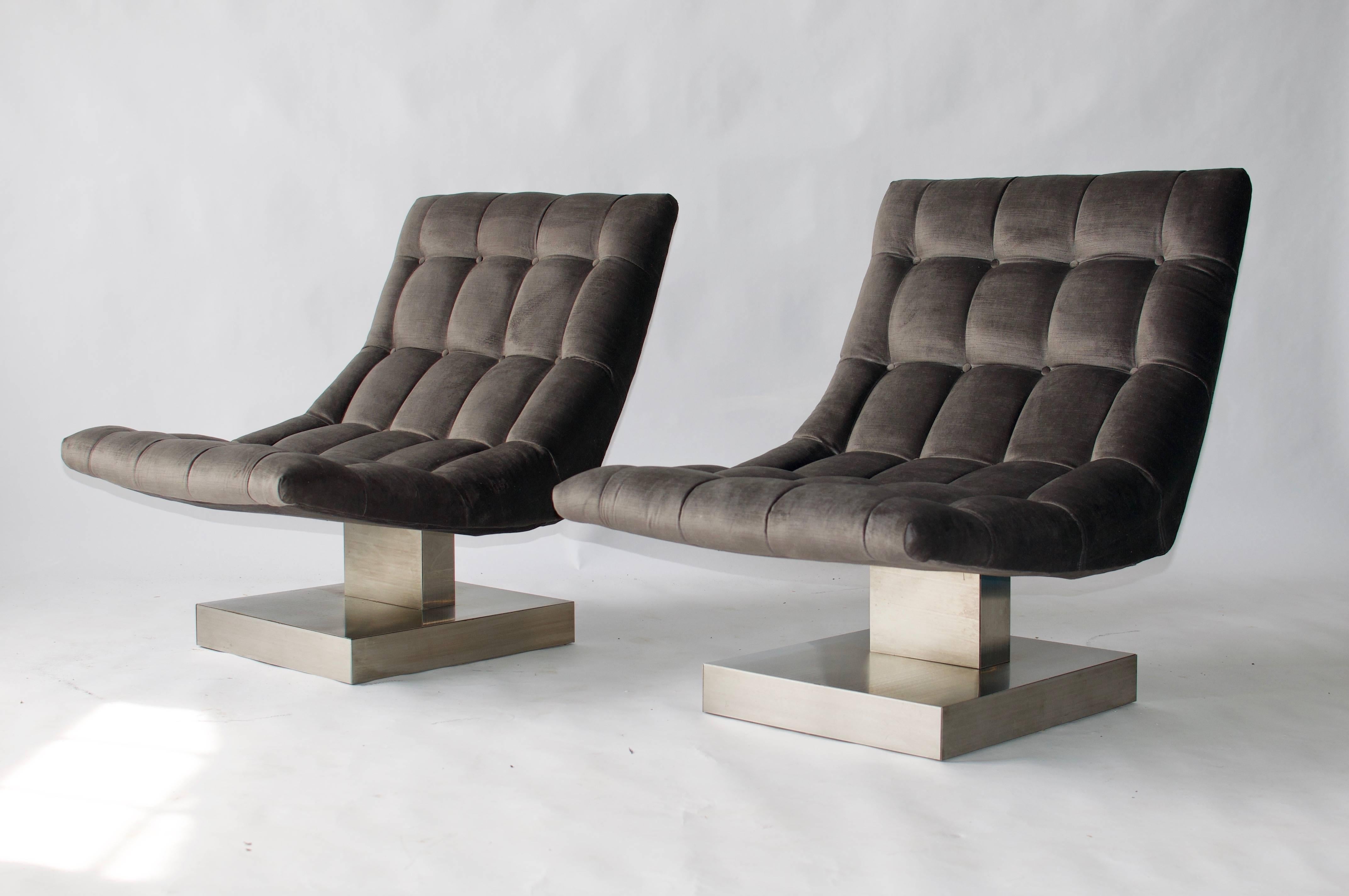 Pair of Milo Baughman cantilevered lounge chairs on chrome pedestal bases.