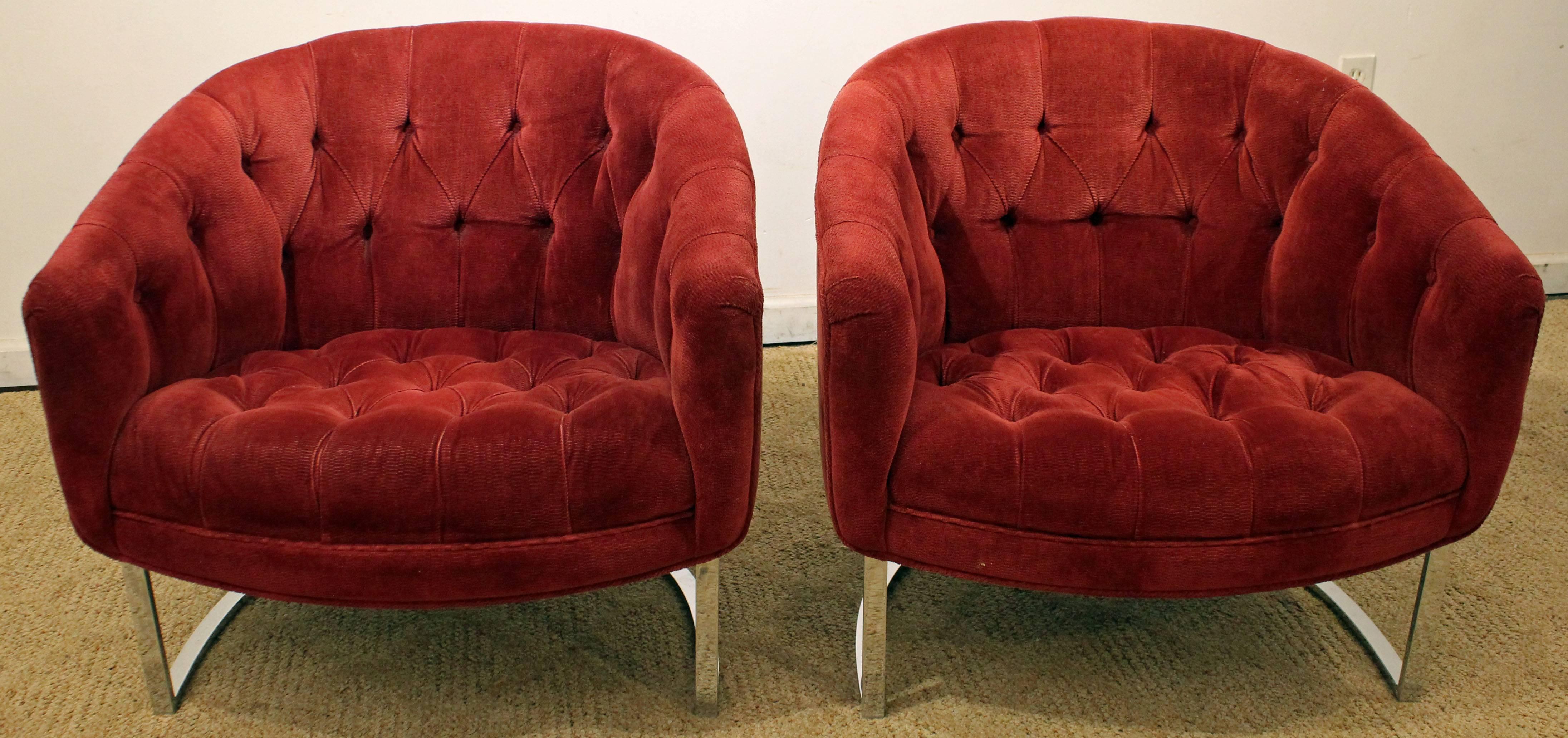 Offered is a pair of chrome barrel-back club chairs. These chairs have been reupholstered at some point and there is no tag.