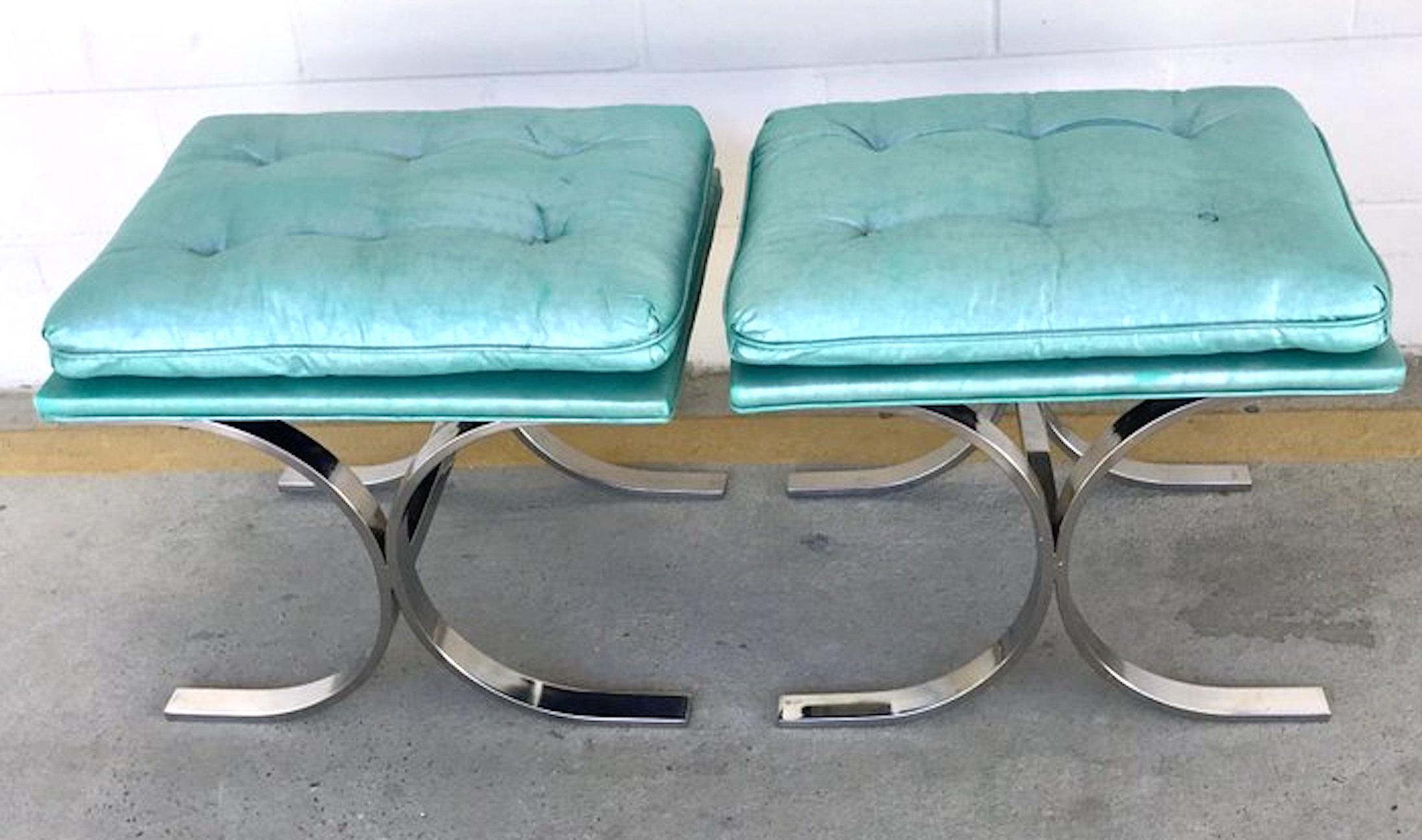 Pair of Milo Baughman style chrome Curule benches, Each one with vintage turquoise upholstered cushions, resting on a typical inverted double 