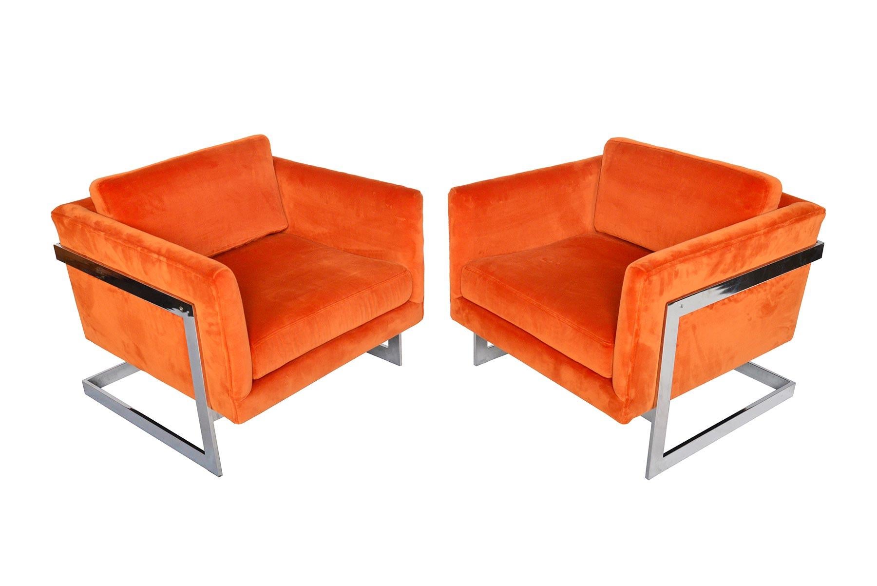 This pair of American midcentury lounge chairs was designed by Milo Baughman for Thayer Coggin in the 1960s. Space Age chrome frames are light and open. Original orange velvet seats hold two removable cushions. In excellent original condition. 

  