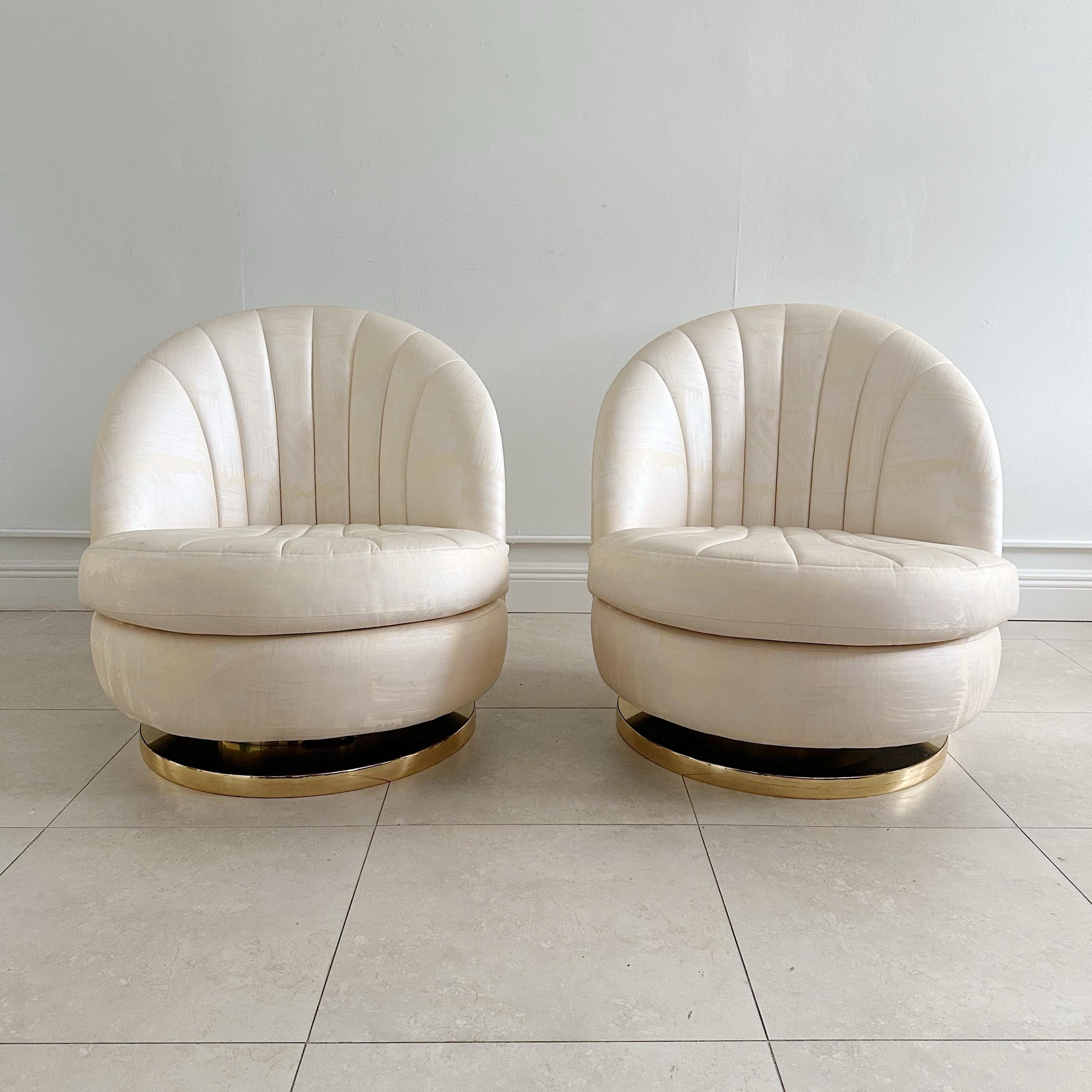 Pair of Milo Baughman for Thayer Coggin swivel and rocking chairs from the 1970s. These Chairs are in great vintage condition with original fabric. Very minor wear consistent with age and use. Brass bases are in great condition with very minor wear