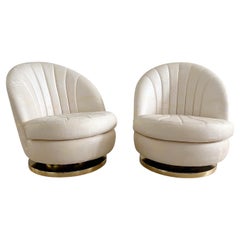 Pair of Milo Baughman Clamshell Swivel Chairs With Brass Basses