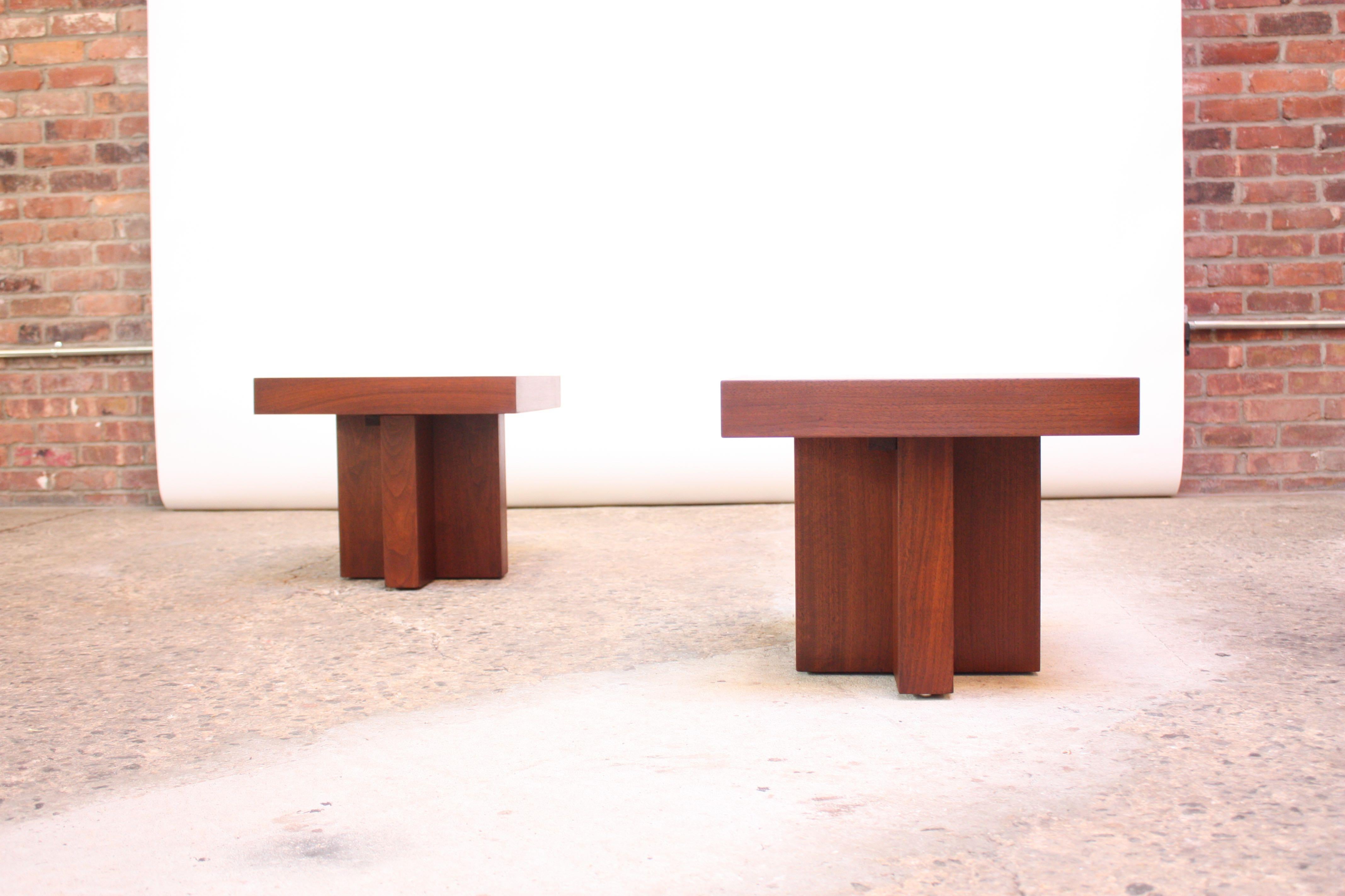 End / occasional tables designed by Milo Baughman (circa 1970) composed of walnut-veneer wrapped rectangular tops on sculpted bases. Beautiful, refinished condition.