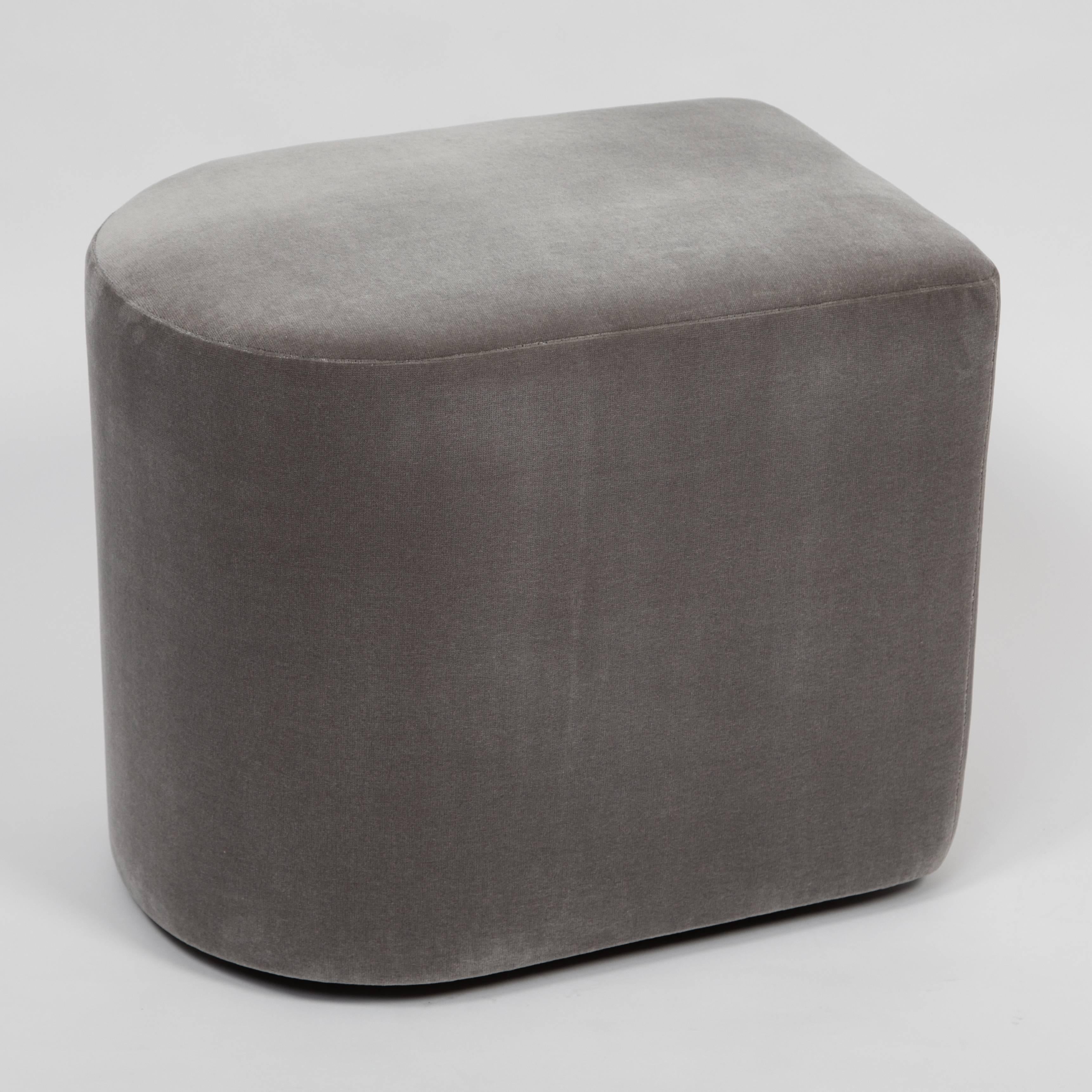 Unusual, rounded 1980s Milo Baughman stools on recessed casters. Newly reupholstered in smokey-gray cotton velvet. Signed 