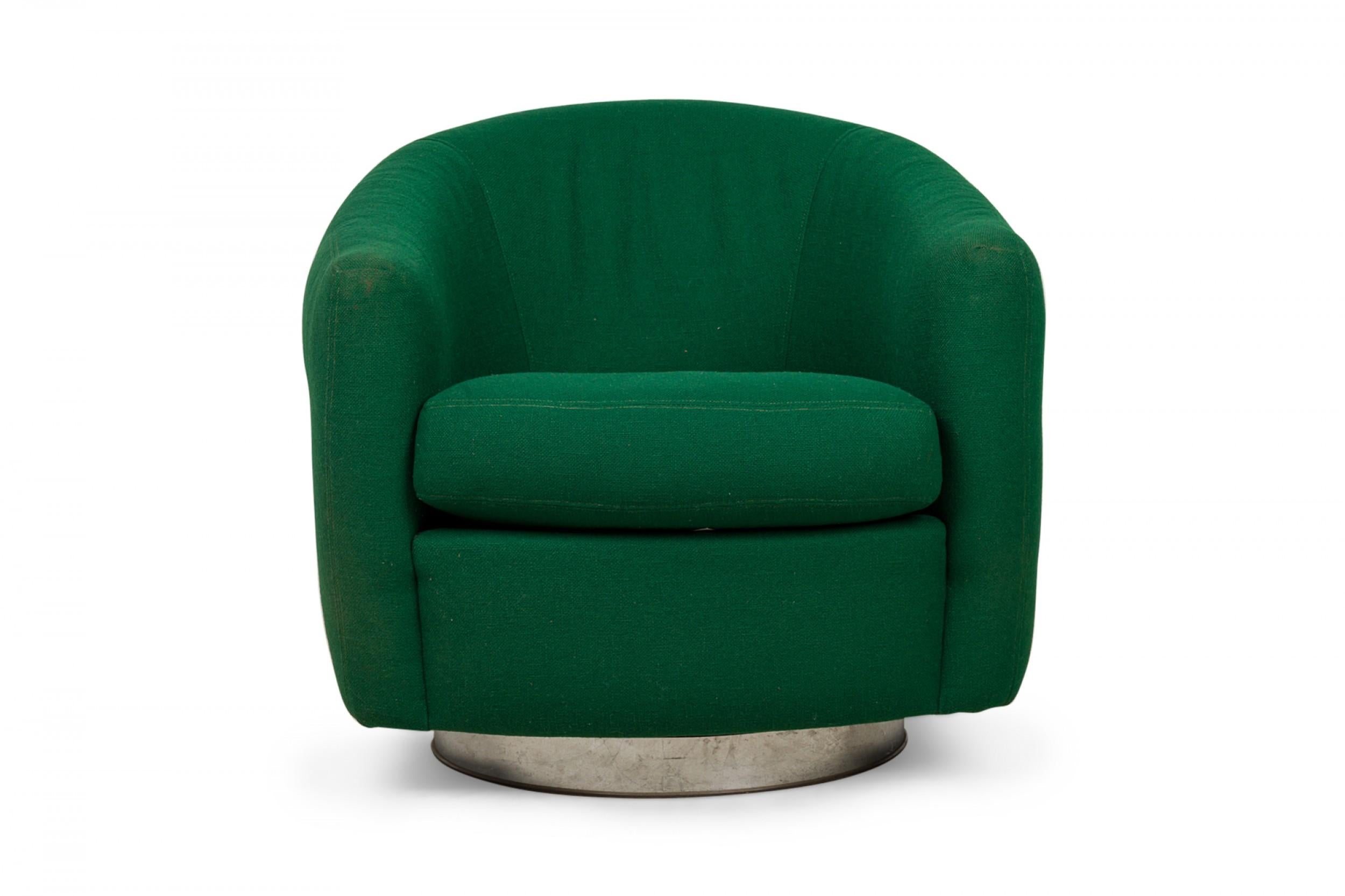 PAIR of American Mid-Century tub form swiveling lounge / armchairs upholstered in emerald green fabric and resting on circular chrome swivel bases. (MILO BAUGHMAN)(PRICED AS PAIR)
