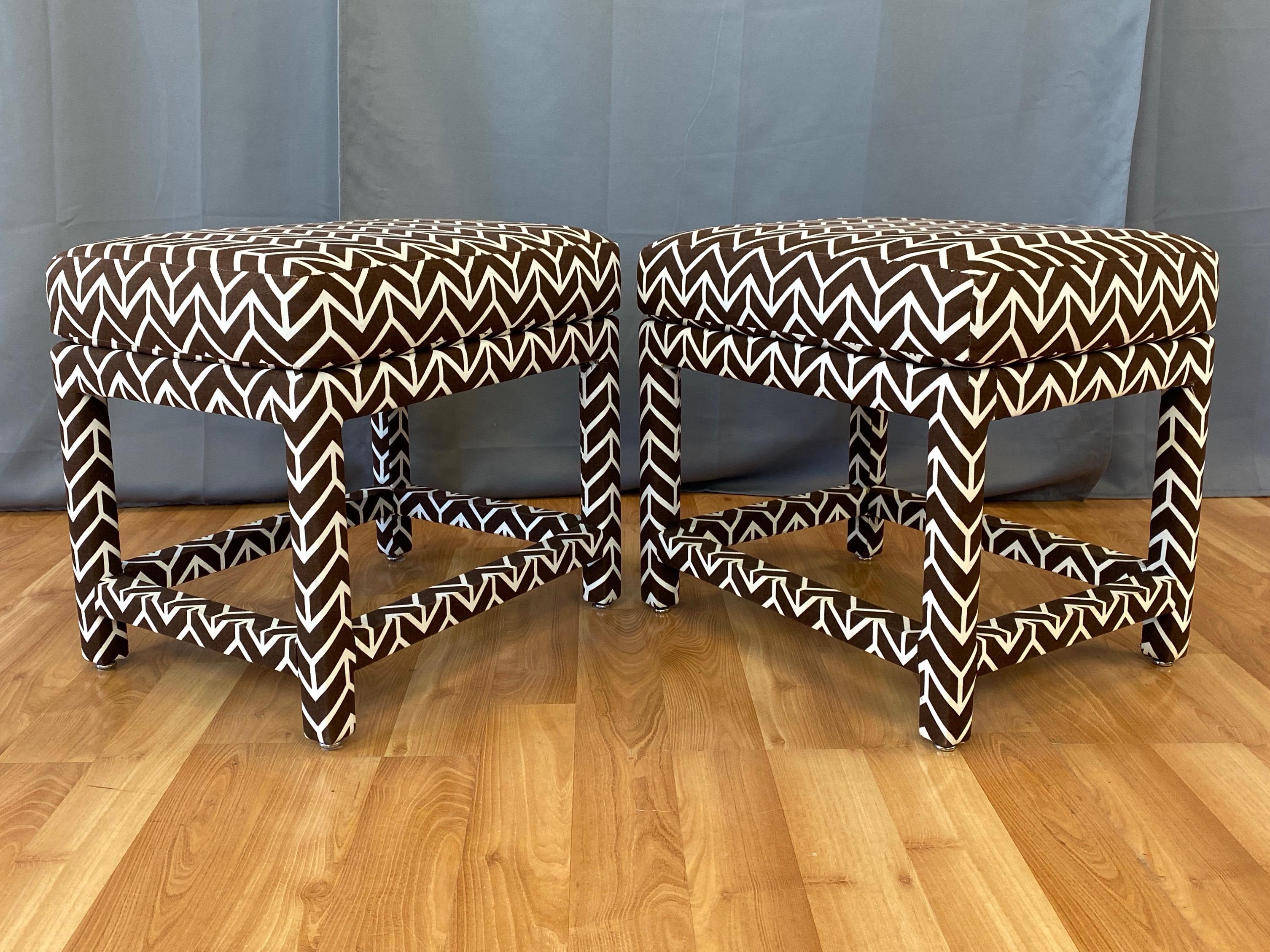 A pair of super chic fully upholstered 1970s ottomans by Milo Baughman for Thayer Coggin.

David Hicks for Schumacher crisp “Chevron” geometric pattern fabric in retired chocolate brown on warm off-white cotton. Upholstery over high-quality and