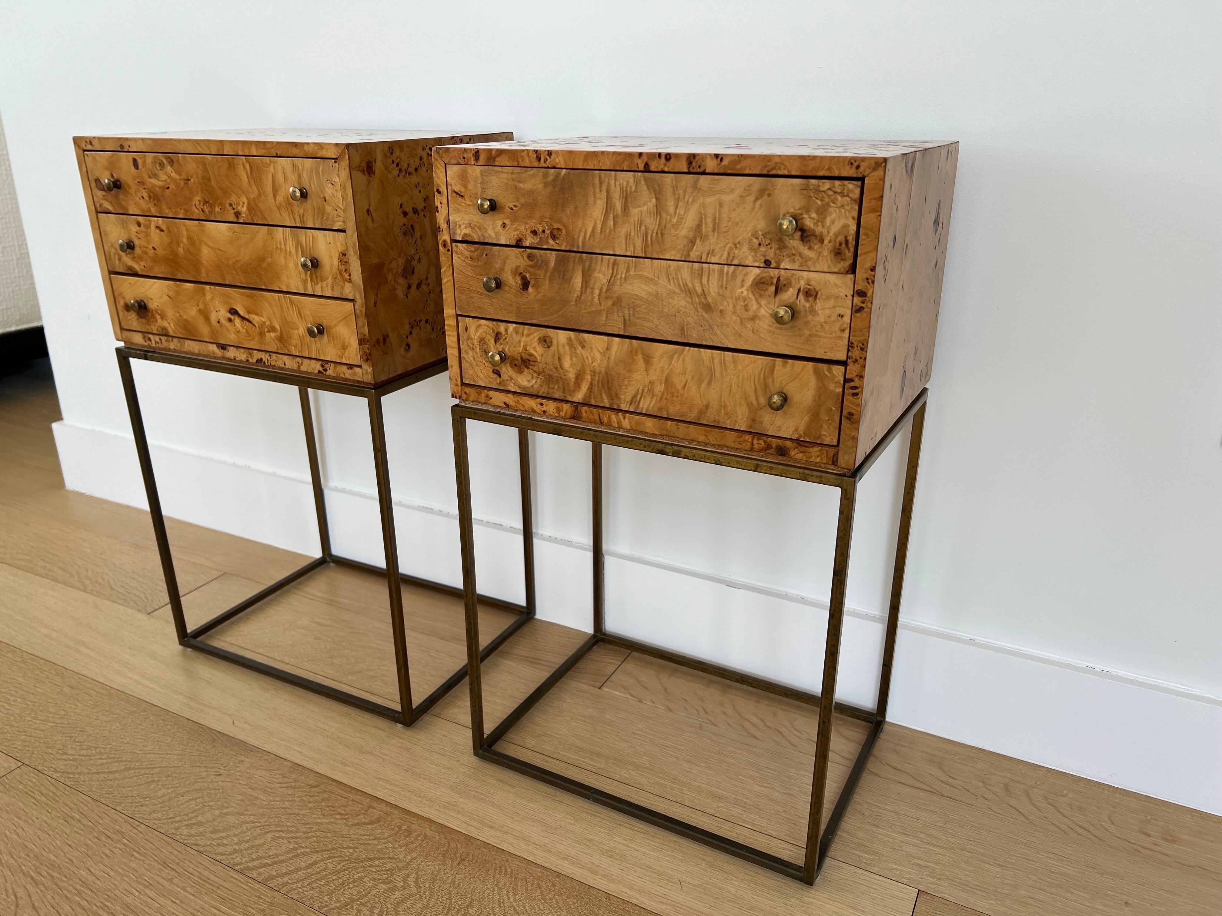 A pair of Milo Baughman burlwood jewelry chests or side tables. Wonderful patina to brass legs and hardware with a light stain on wood. Similar patina and wear to both and presents well together.