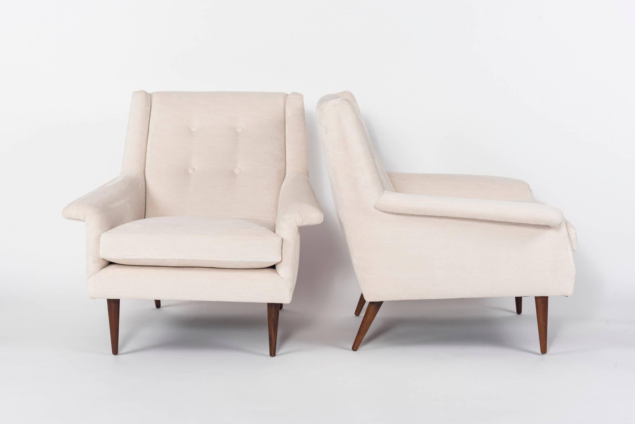 Pair of Milo Baughman chairs. These chairs were taken down to the frames and professionally upholstered with cream colored striated velvet fabric. This comfortable pair of midcentury lounge chairs both retain their original Milo Baughman for Thayer