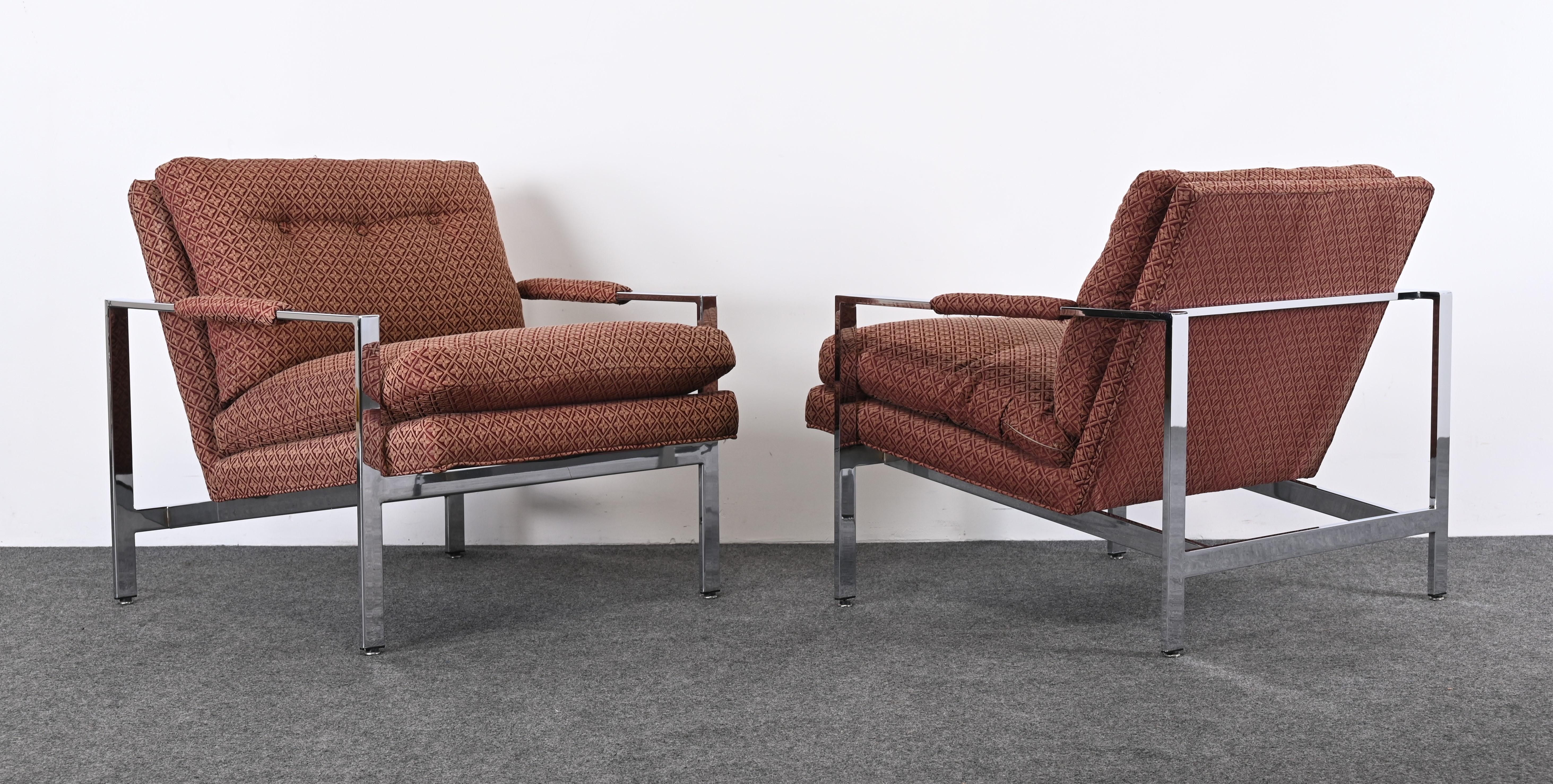 An elegant pair of flat bar chrome upholstered lounge chairs designed by Milo Baughman for Thayer Coggin. These armchairs are vintage and upholstered in the original fabric. The fabric is in good condition but you may want to reupholster. The chrome