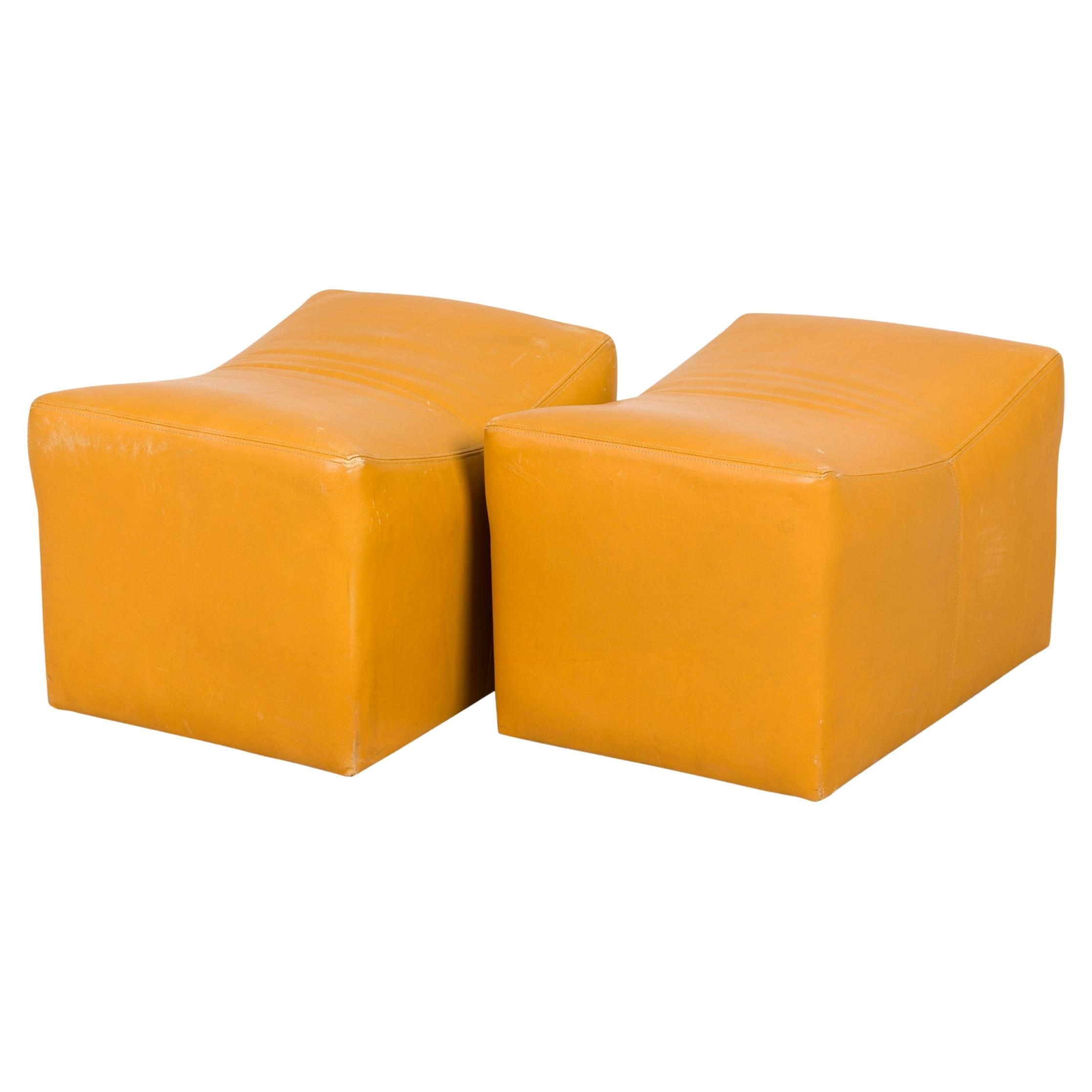 Pair of Milo Baughman Mustard Yellow Leather Rolling Saddle Ottomans