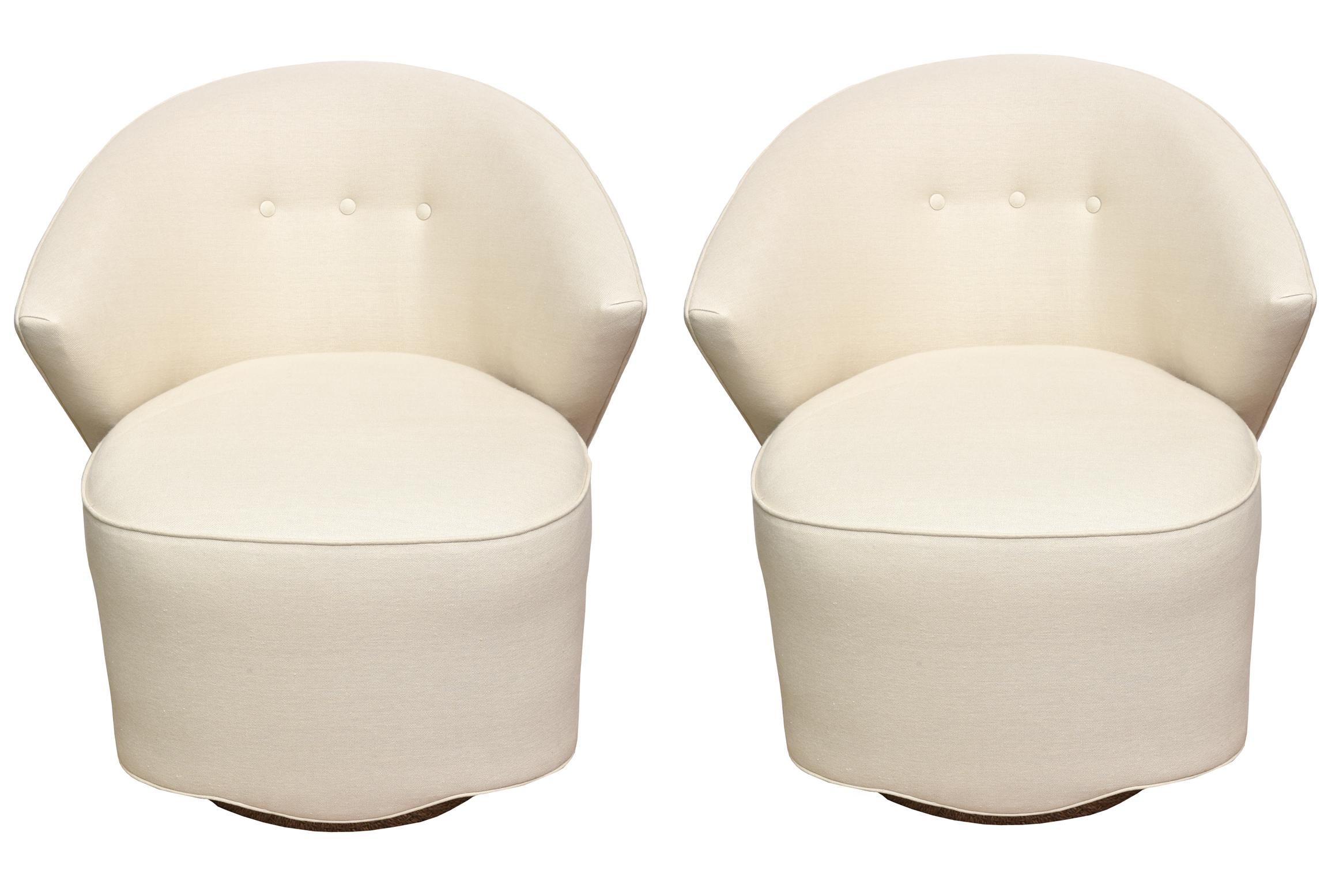 These amazing fully restored pair of Michael Wolk sculptural swivel side or lounge chairs are stunning. These were designs by Michael Work for Directional in 1997. They have been newly re-upholstered in an off-white to tan linen and cotton