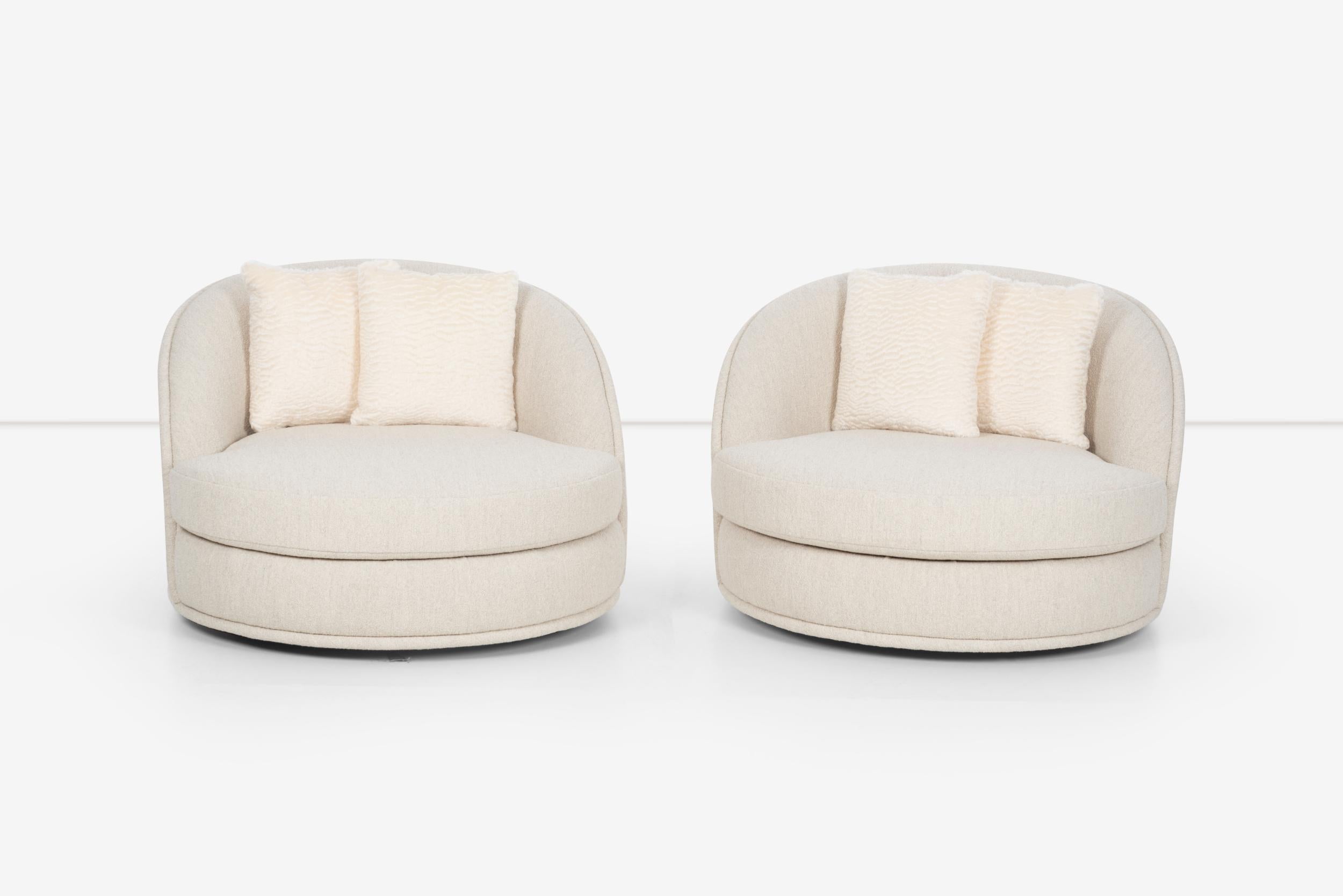 Pair of Milo Baughman Style oversized swivel lounge chairs by Directional, Reupholstered in Italian Boucle.
Pillows; Faux lamb Great Plains, Tusk 100% mohair

Measures: Seat Height: 16