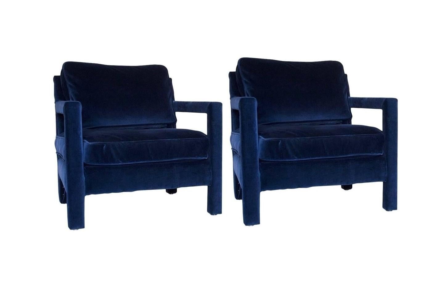 These lovely, well-constructed fully upholstered armchairs. Completely redone with new high density foam and upholstered in a deep blue velvet, these are comfortable and sensual to the touch. The cubist design and vibrant, earthy color elevate the