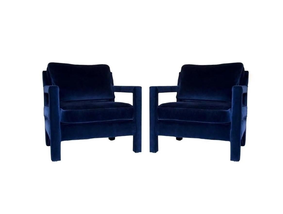 These lovely, well-constructed fully upholstered Parsons chairs in the style of Milo Baughman. The iconic chairs completely redone with new high density foam and upholstered in a deep blue velvet, these are so luxuriously comfortable and sensual to