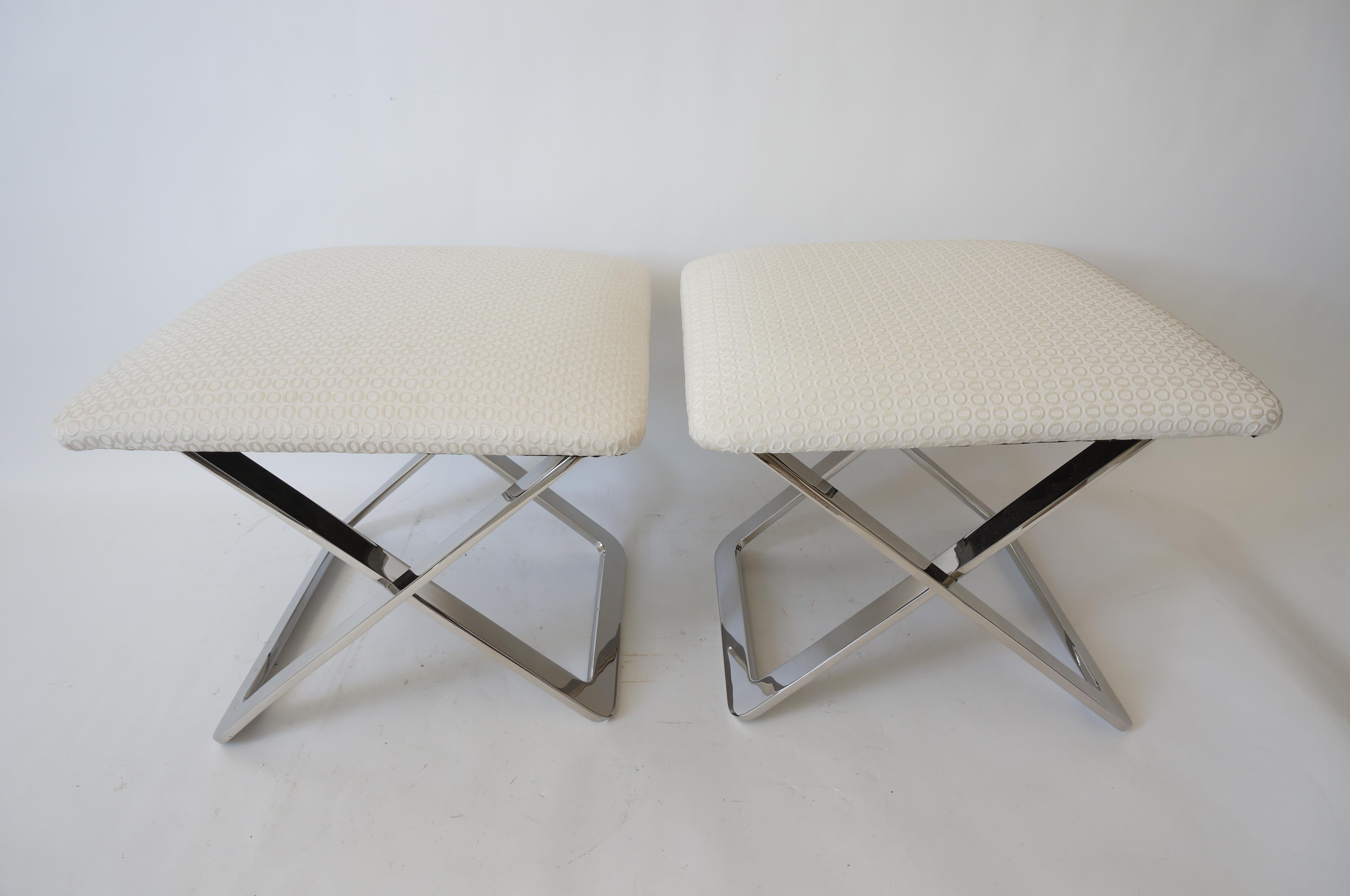 This stylish and chic pair of x-form stools are very much in the style of Milo Baughman's flat bar collection.

Note: The pieces have been professionaly upholstered in a woven fabric.