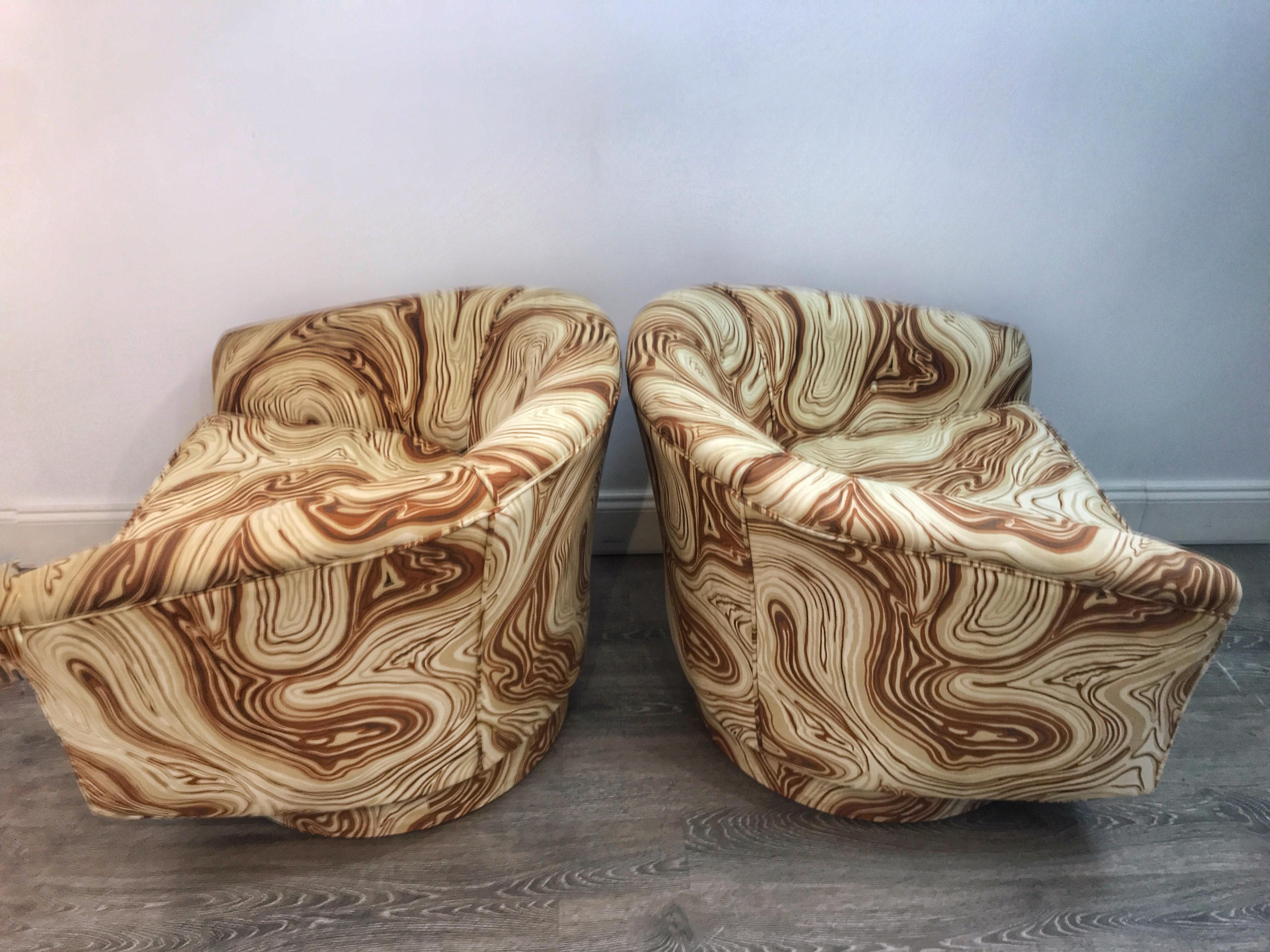 Pair of Sheik Milo Baughman style swivel chairs with custom marbleized upholstery, upholstery is in excellent condition and appears to be recent. Presents beautifully.