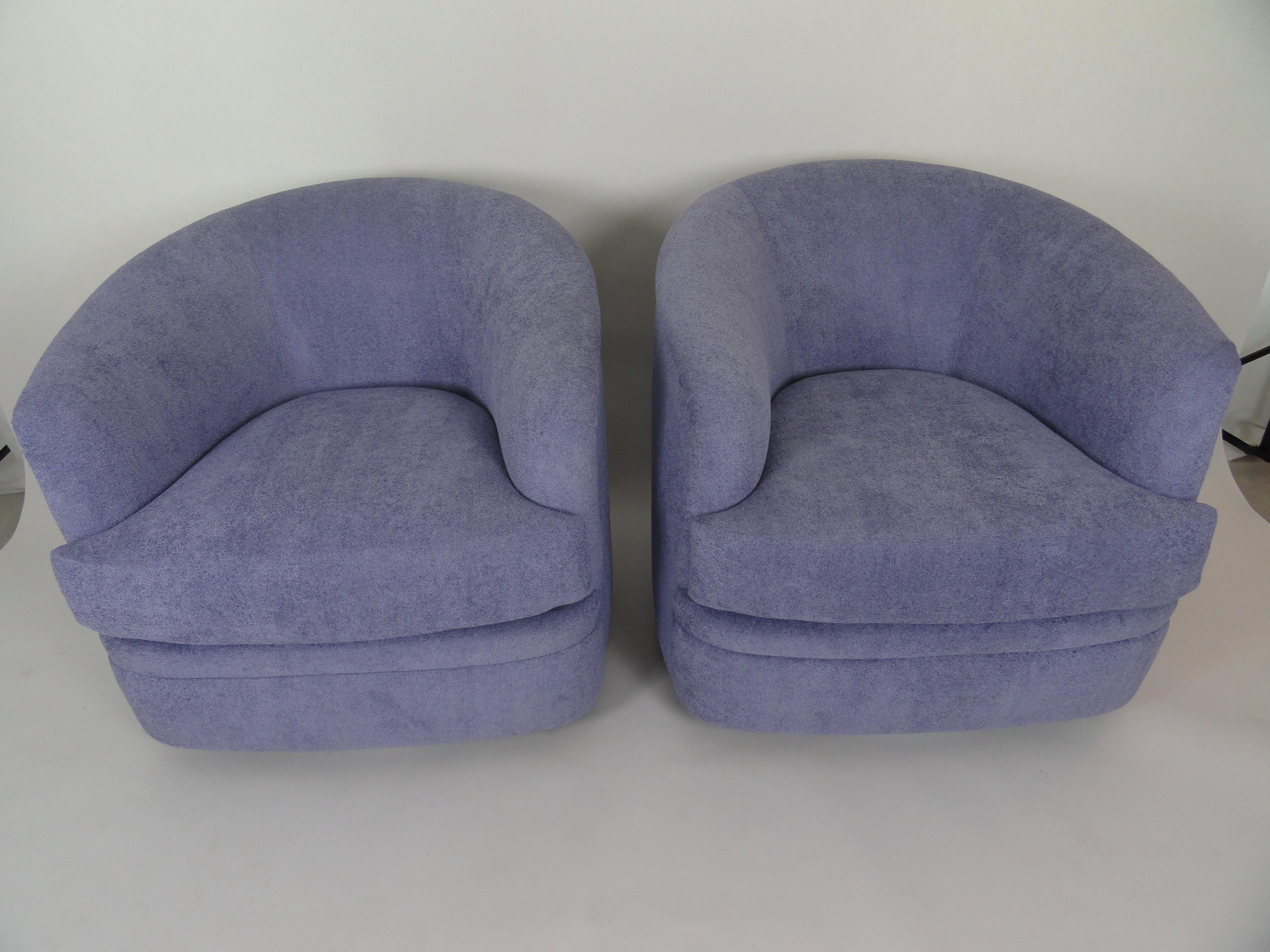 Pair of Milo Baughman style swivel lounge chairs, newly upholstered in indoor outdoor fabric.
