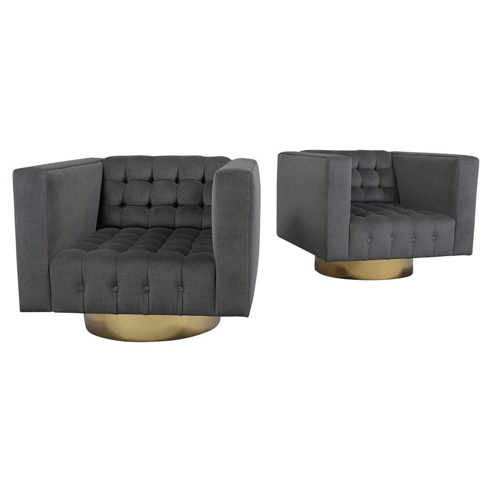 An extraordinary pair mid-century of modern swivel lounge chairs has been professionally restored and features new dark grey color mohair fabric upholstery with a biscuit tufted design. This pair of club chairs have a comfortable seat and backrest
