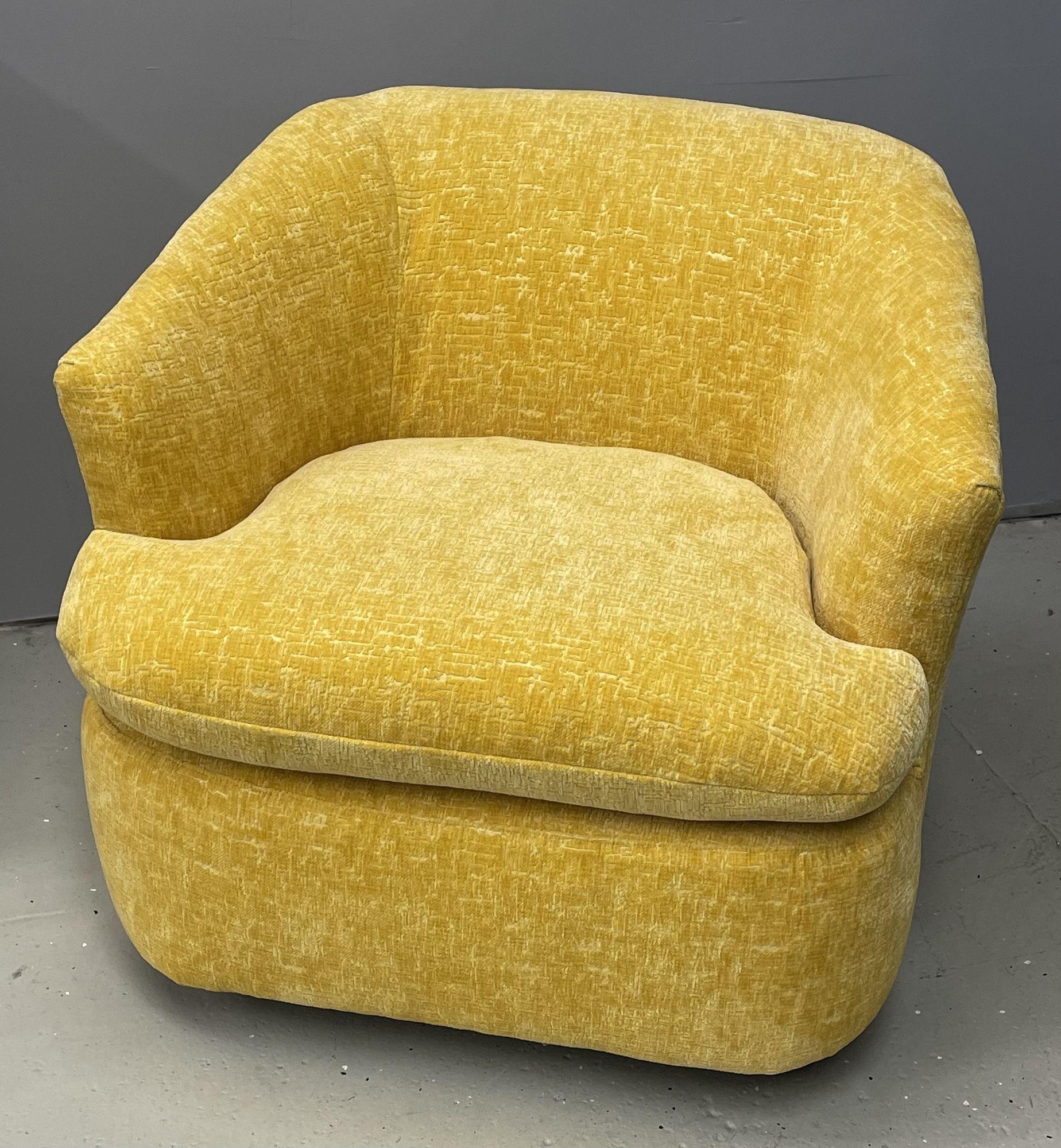 Pair of Milo Baughman style swivel / tub chairs, in a new Yellow Textured Upholstery
 
These recently upholstered pair of club or tub chairs sit on strong metal swivel bases. The pair extreamly comfortable. 
 
Other American designers of the