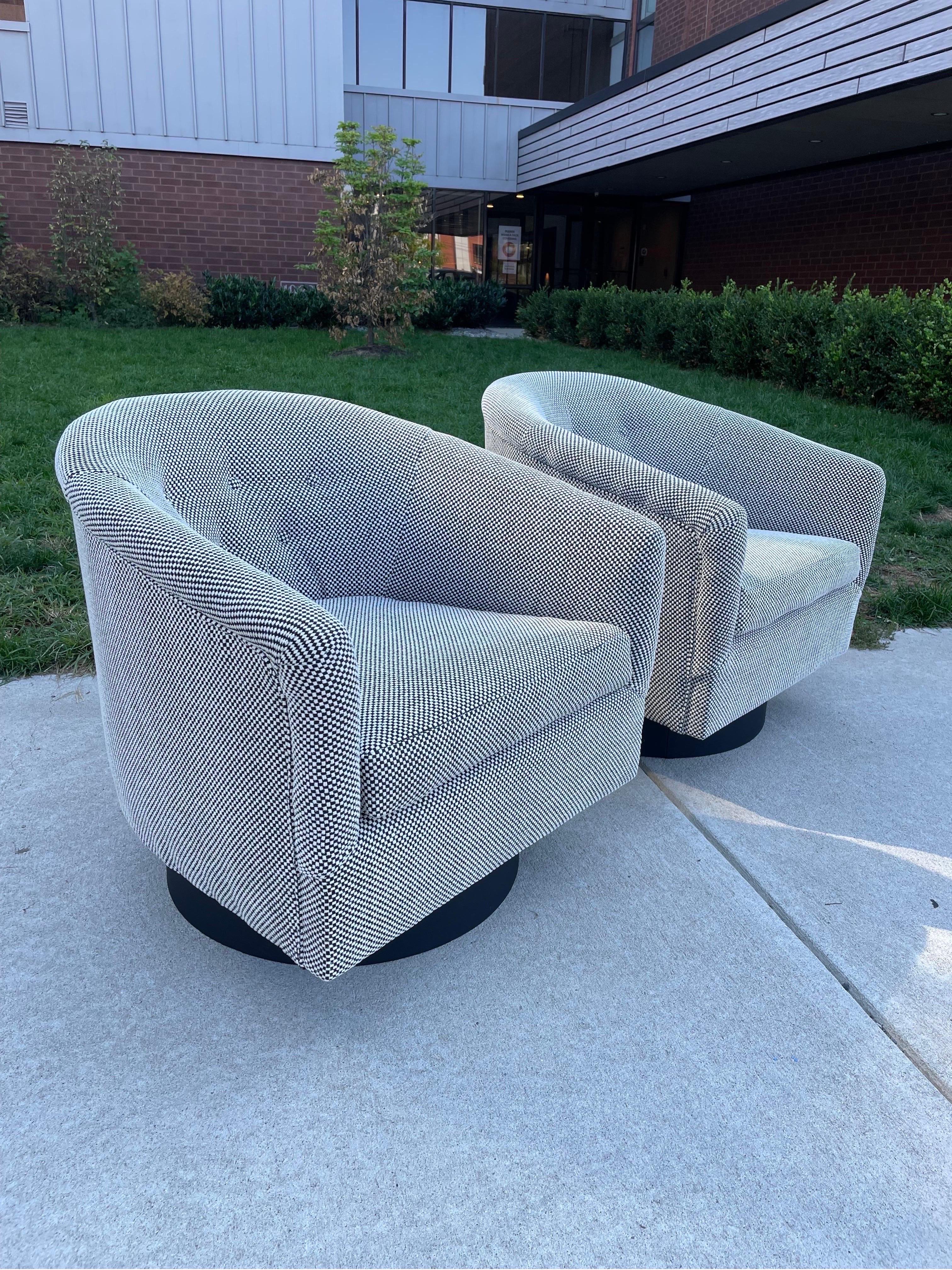 Newly reupholstered MCM swivel chairs by Milo Baughman.