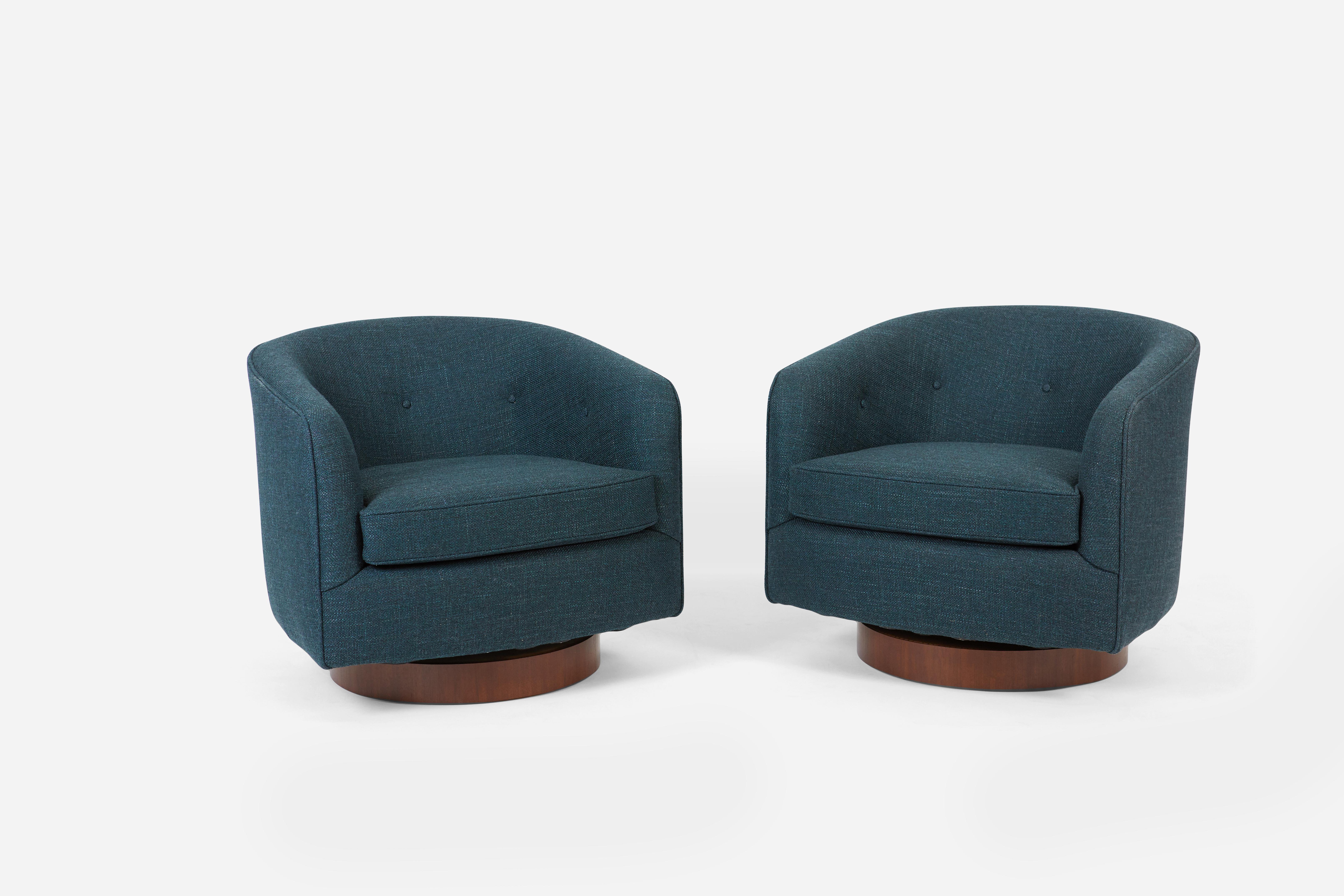 Pair of swivel chairs by Milo Baughman. Fully restored. New upholstery over refinished walnut bases.