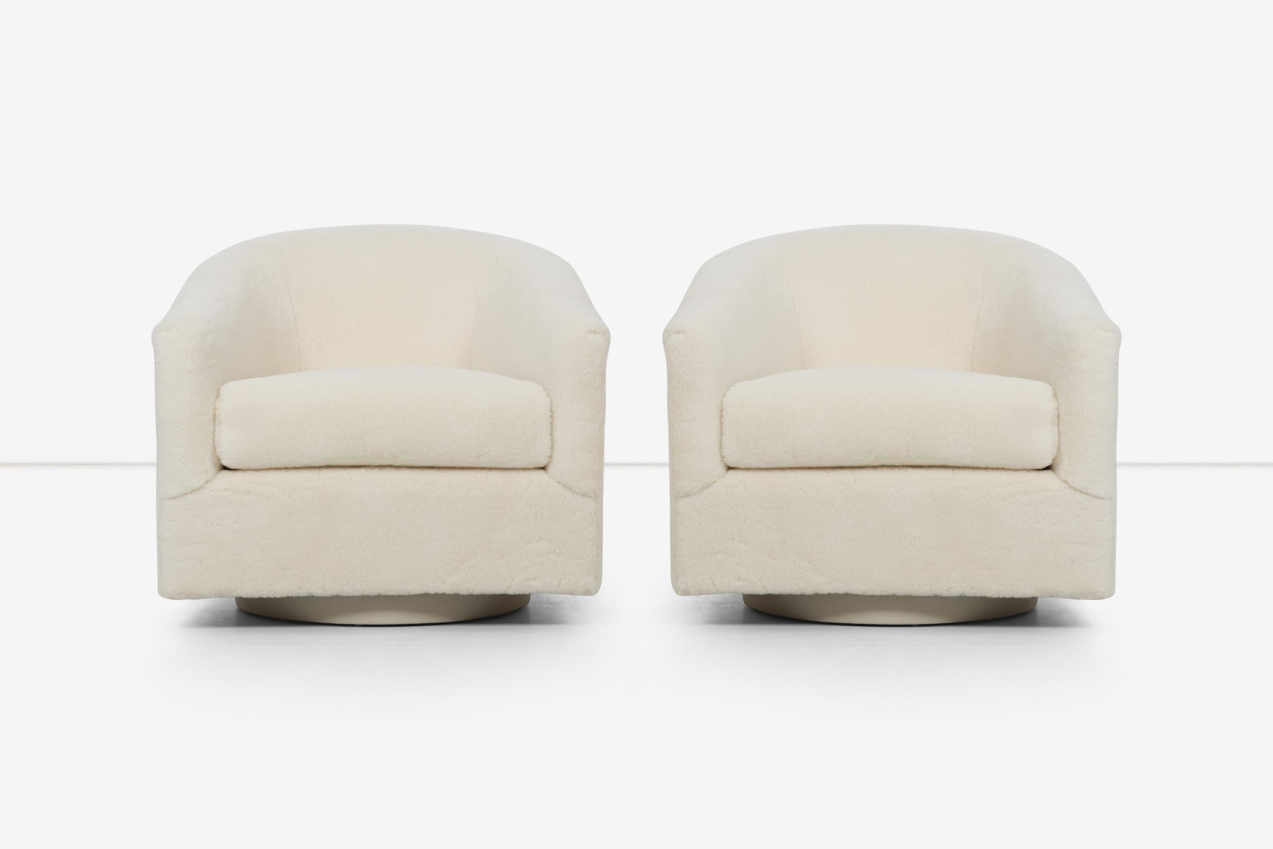 Pair of Milo Baughman swivel lounge chairs, reupholstered in thick shearling: Winter white 100% wool, with leather wrapped bases.