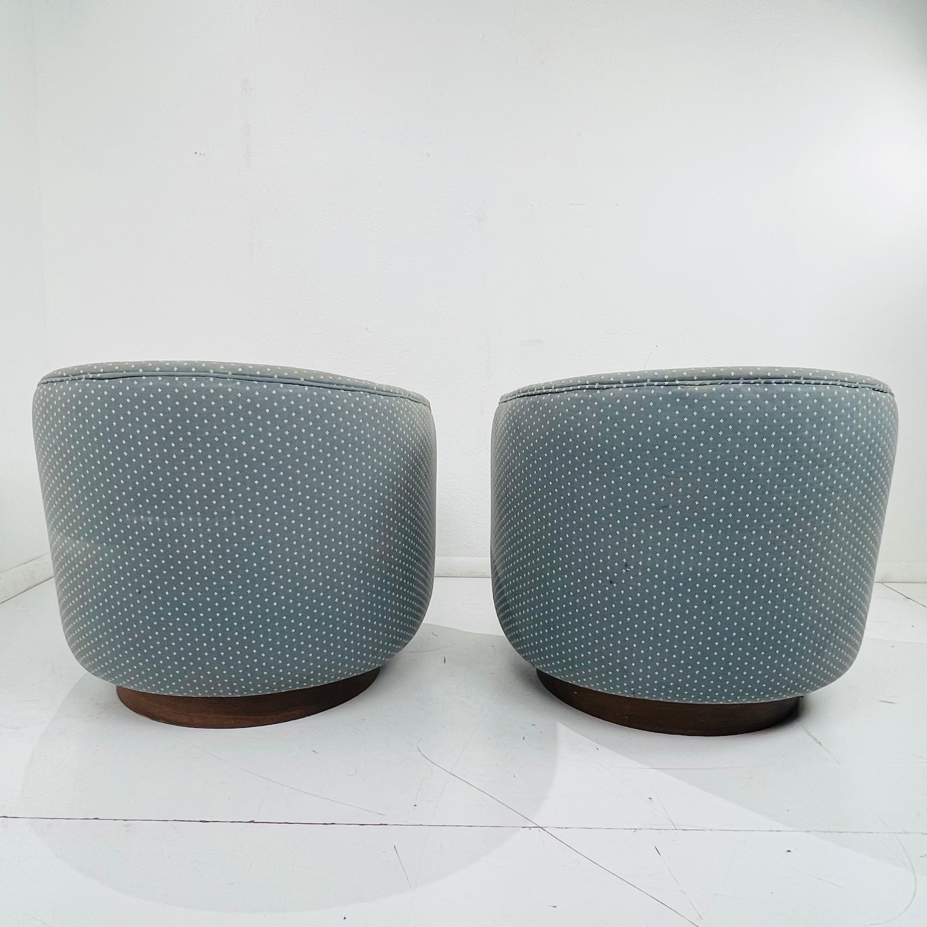 American Pair of Milo Baughman Swivel / Tilt Chairs on Walnut Plinth Bases
