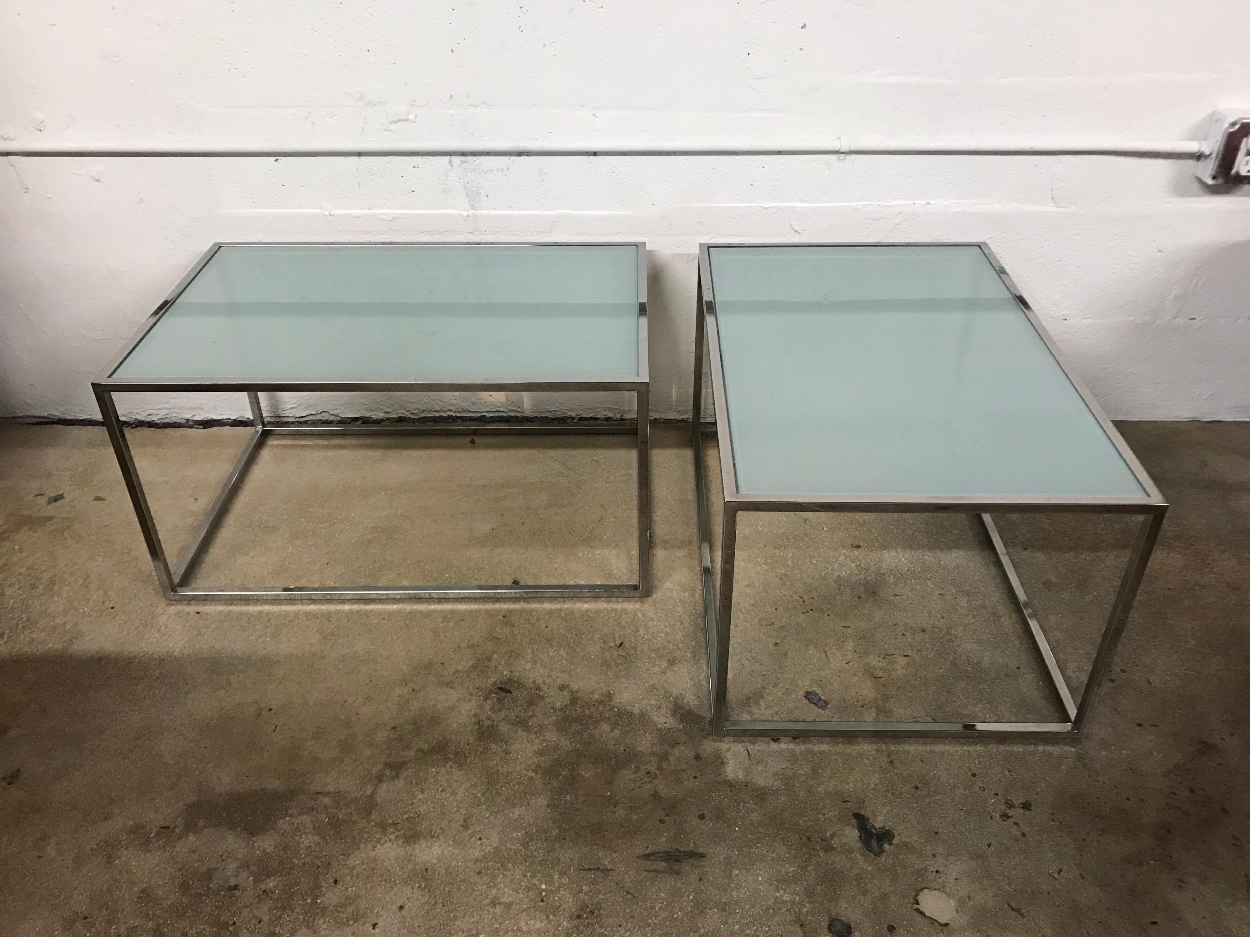 Set of two Thinline coffee cocktail side or end tables in the style of Milo Baughman rendered in chrome-plated steel with frosted glass tops, can be configured in multiple ways to be used as a coffee table grouping or separate for flanking side or