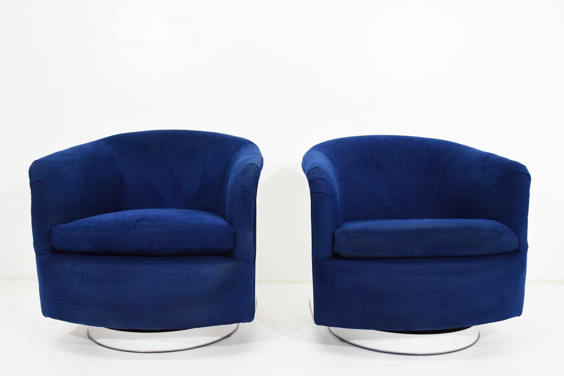 Beautiful pair of Milo Baughman tilt/swivel lounge chairs in blue upholstery with a white lacquer back and base.