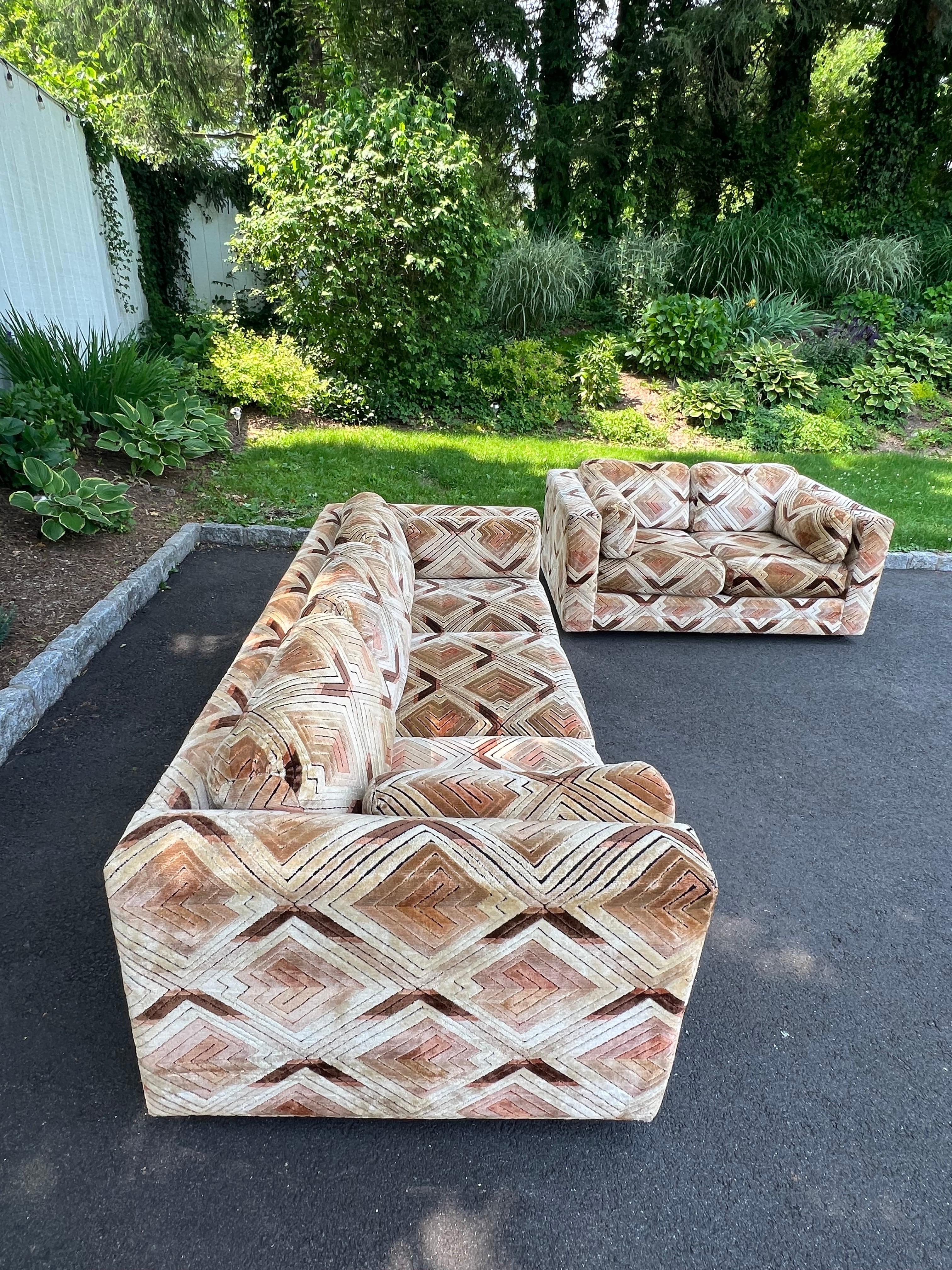 Pair of Milo Baughman Tuxedo Sofas in Chevron Pattern. The Chevron patterned fabric is most likely designed by Jack Lenor Larsen . This velvet fabric is very durable and in great shape. The light version of this upholstery is called 