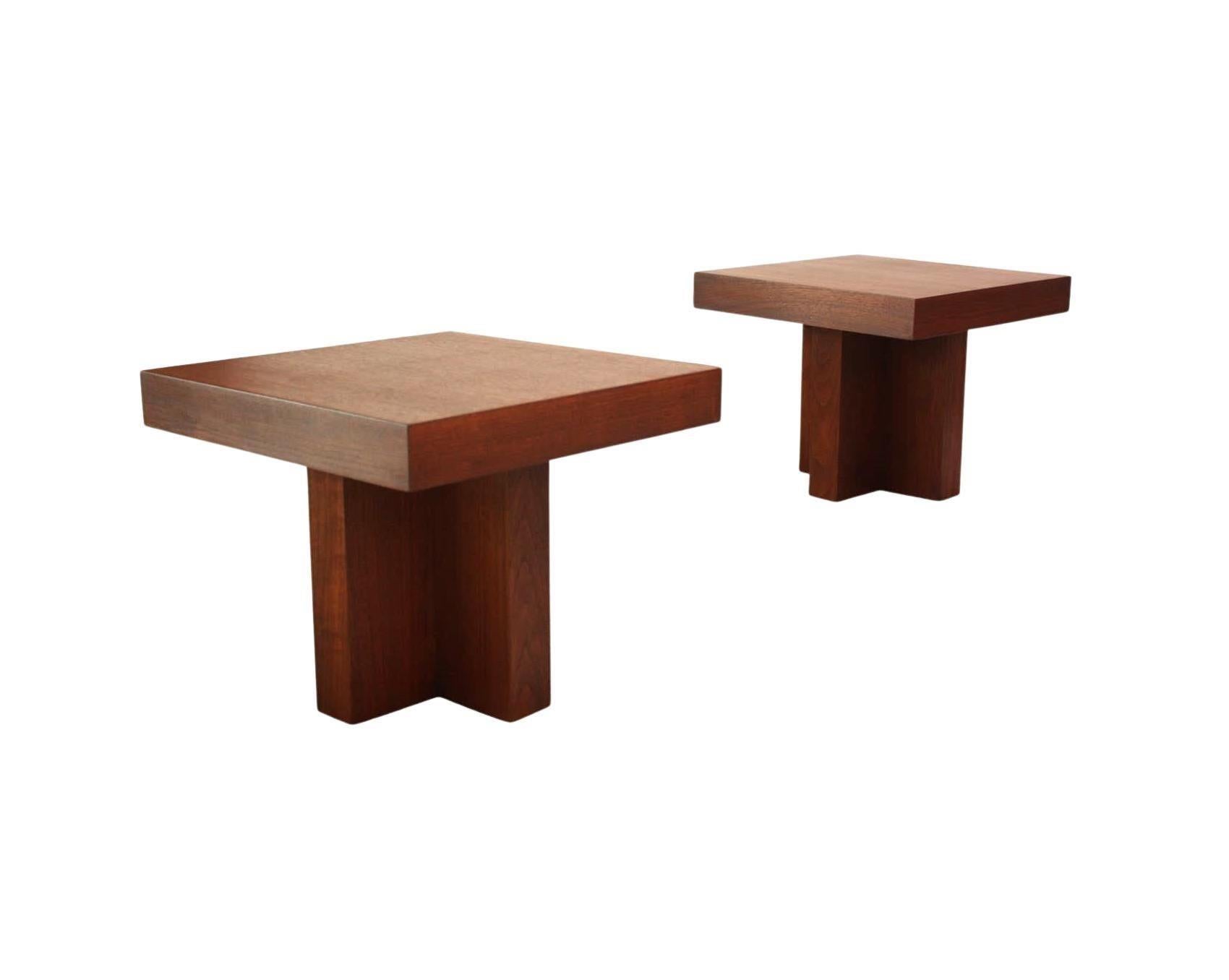 Architectural Modernist Design! Pair of walnut occasional tables Model 1922, by Milo Baughman for Thayer Coggin, circa 1960s. Featuring incredibly proportioned thick tops resting on modern cruciform bases. These tables have a clean lined design,
