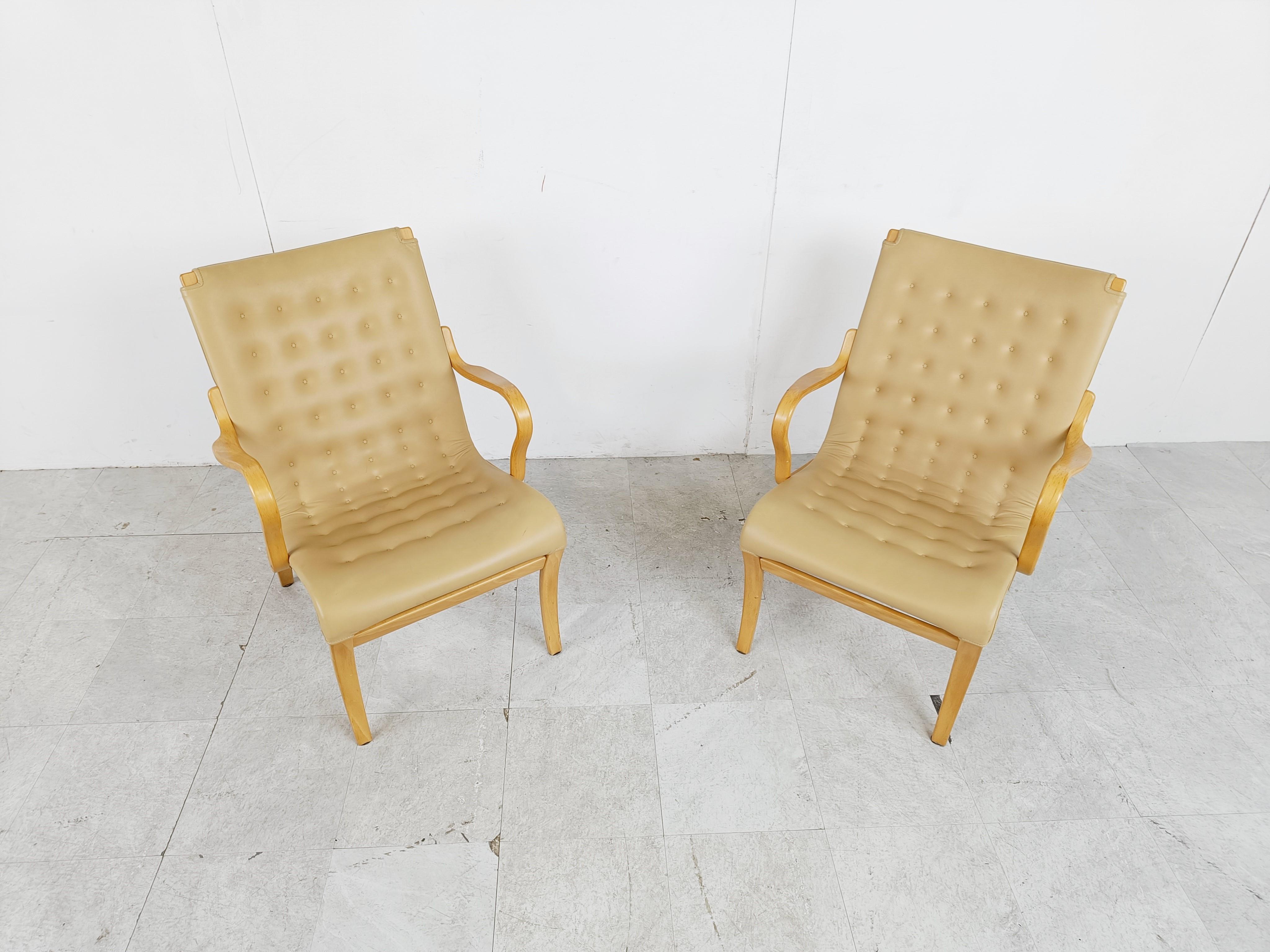 Midcentury tufted leather 'Mina' armchairs designed by Bruno Mathsson for DUX

The chair have beautiful and elegant beech wooden frames upholstered with high quality leather.

Good condition

1960s - Sweden.

Dimensions:
Height: